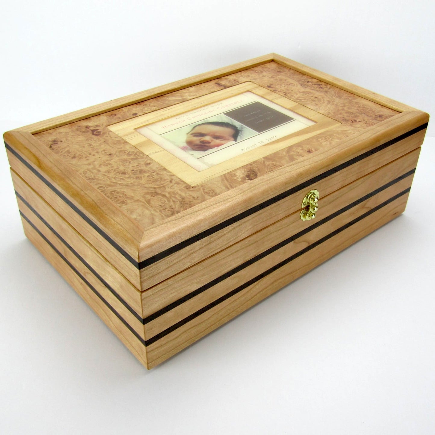 Full view corner of children's memory box with photo lid handmade from cherry and wenge by A Finer Cut Woodworking.