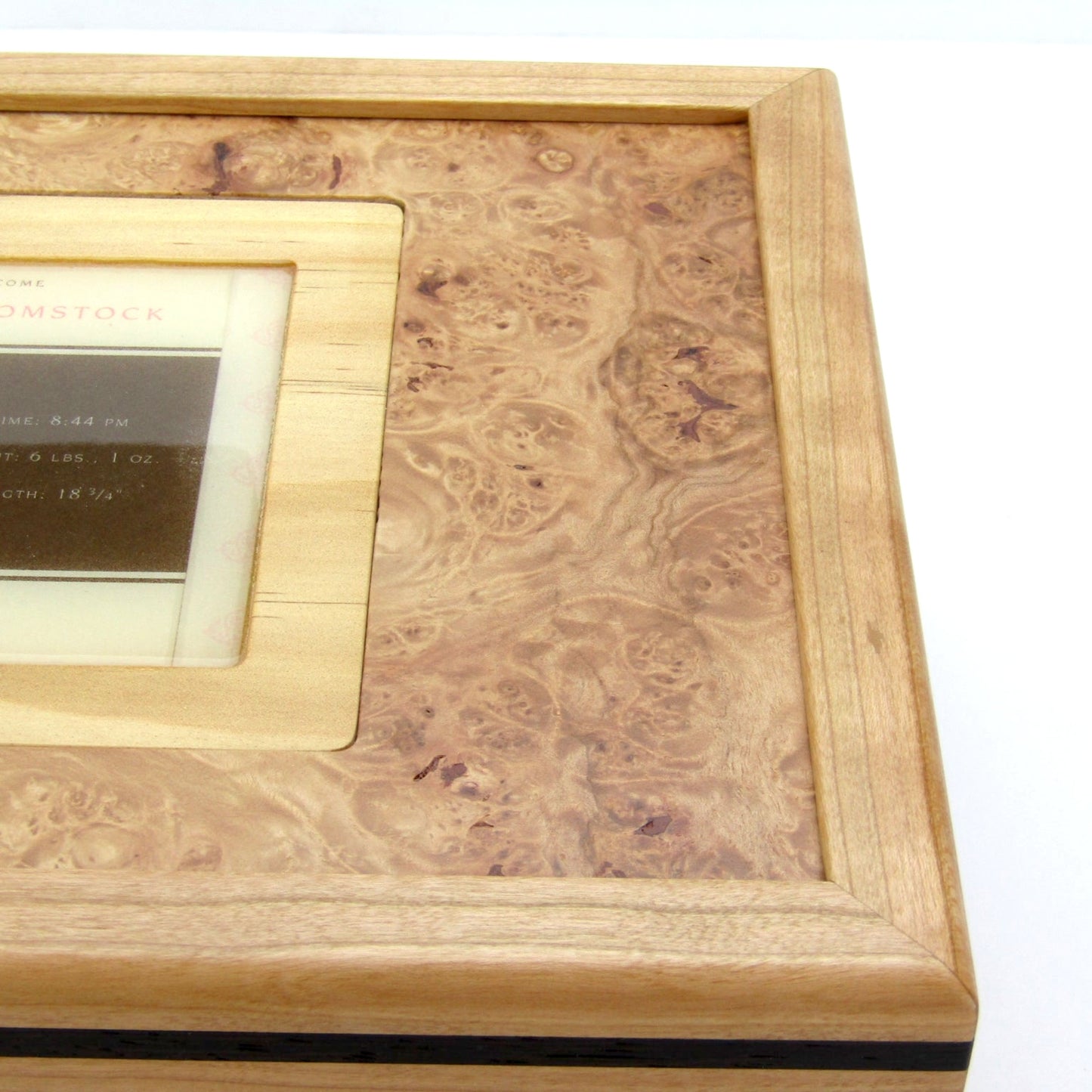 Lid detail on children's memory box with photo lid handmade from cherry and wenge by A Finer Cut Woodworking.