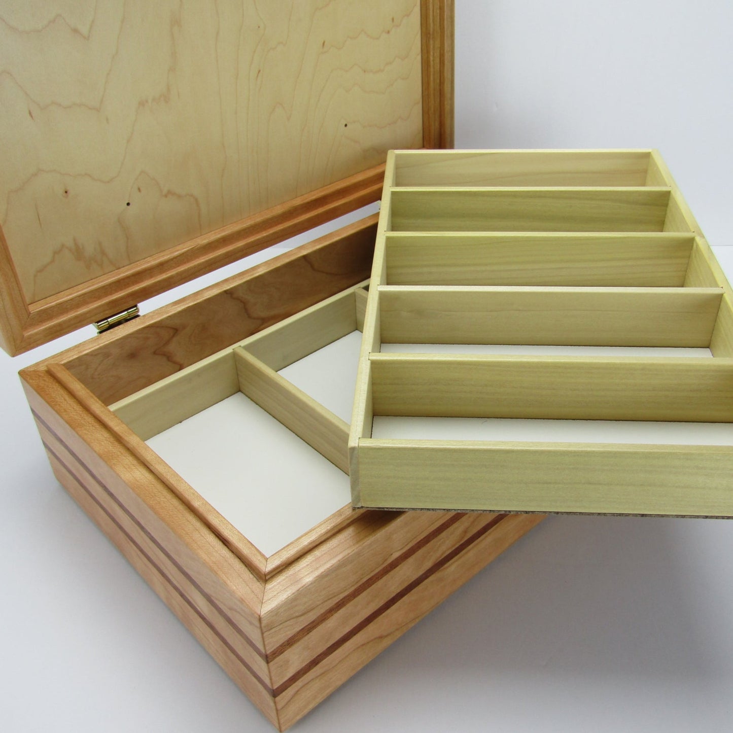 Divided trays for children's memory box with photo lid handmade from cherry and wenge by A Finer Cut Woodworking.