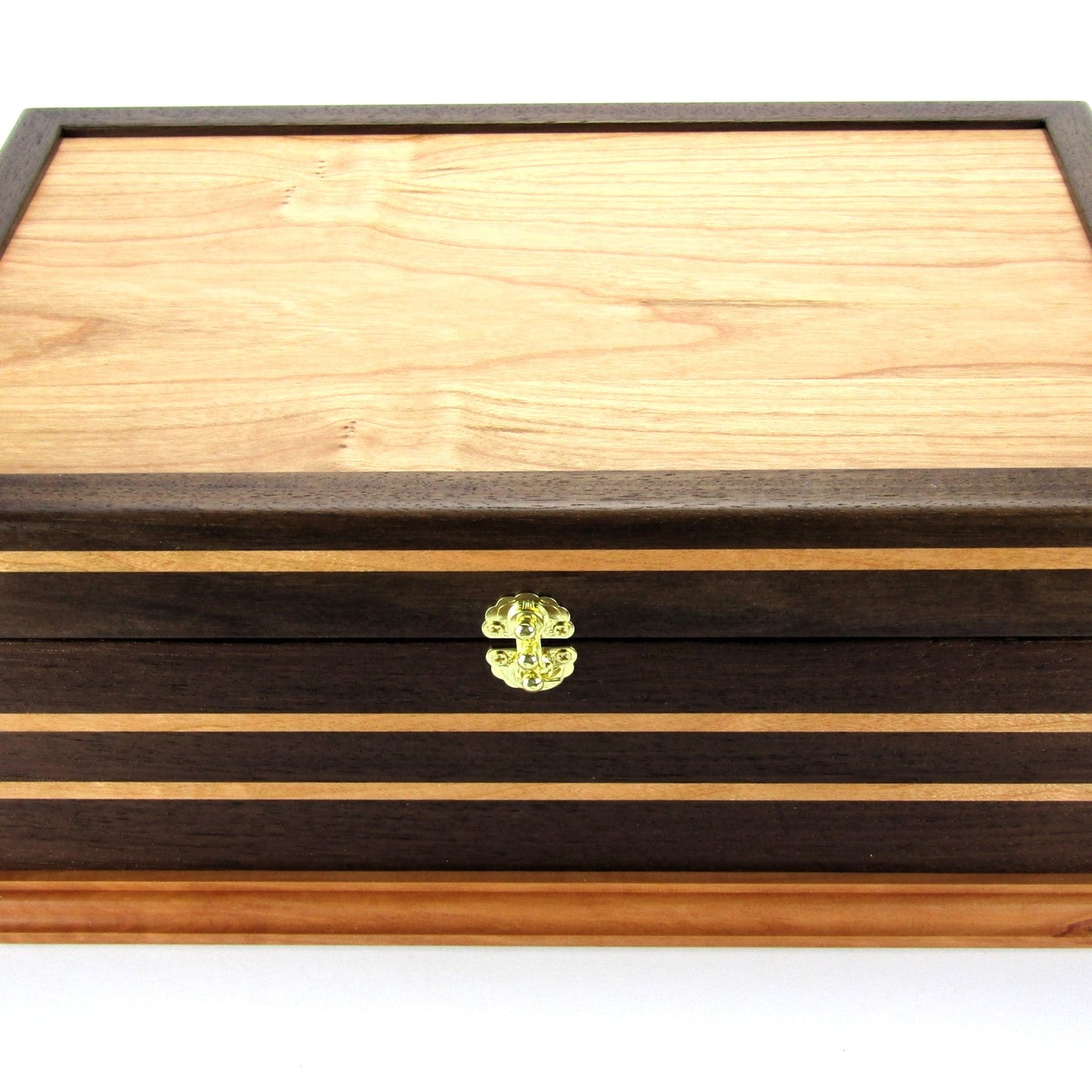 Front view of handmade keepsake box crafted from Peruvian walnut, cherry, cherry veneer, and a pear base by A Finer Cut Woodworking.