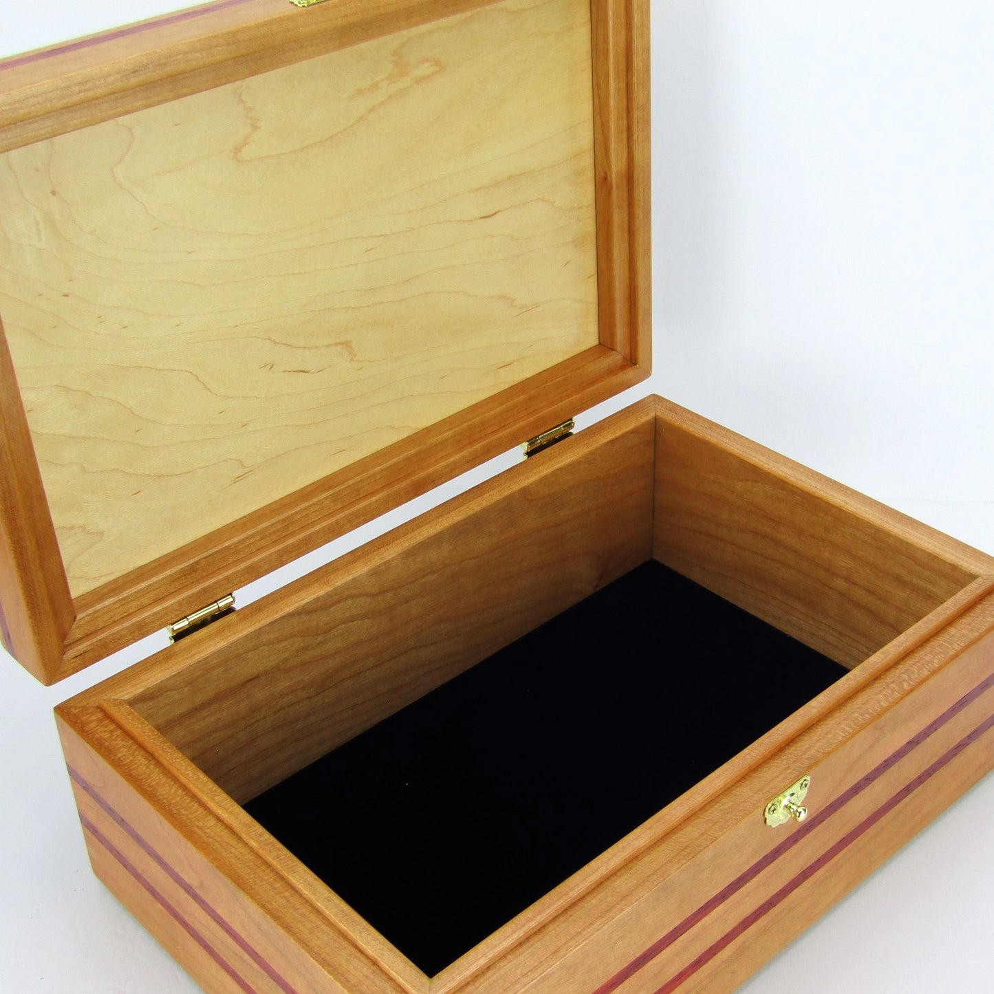 Interior view of handmade memory box crafted from cherry and mahogany wood with padauk inlays by A Finer Cut Wood.