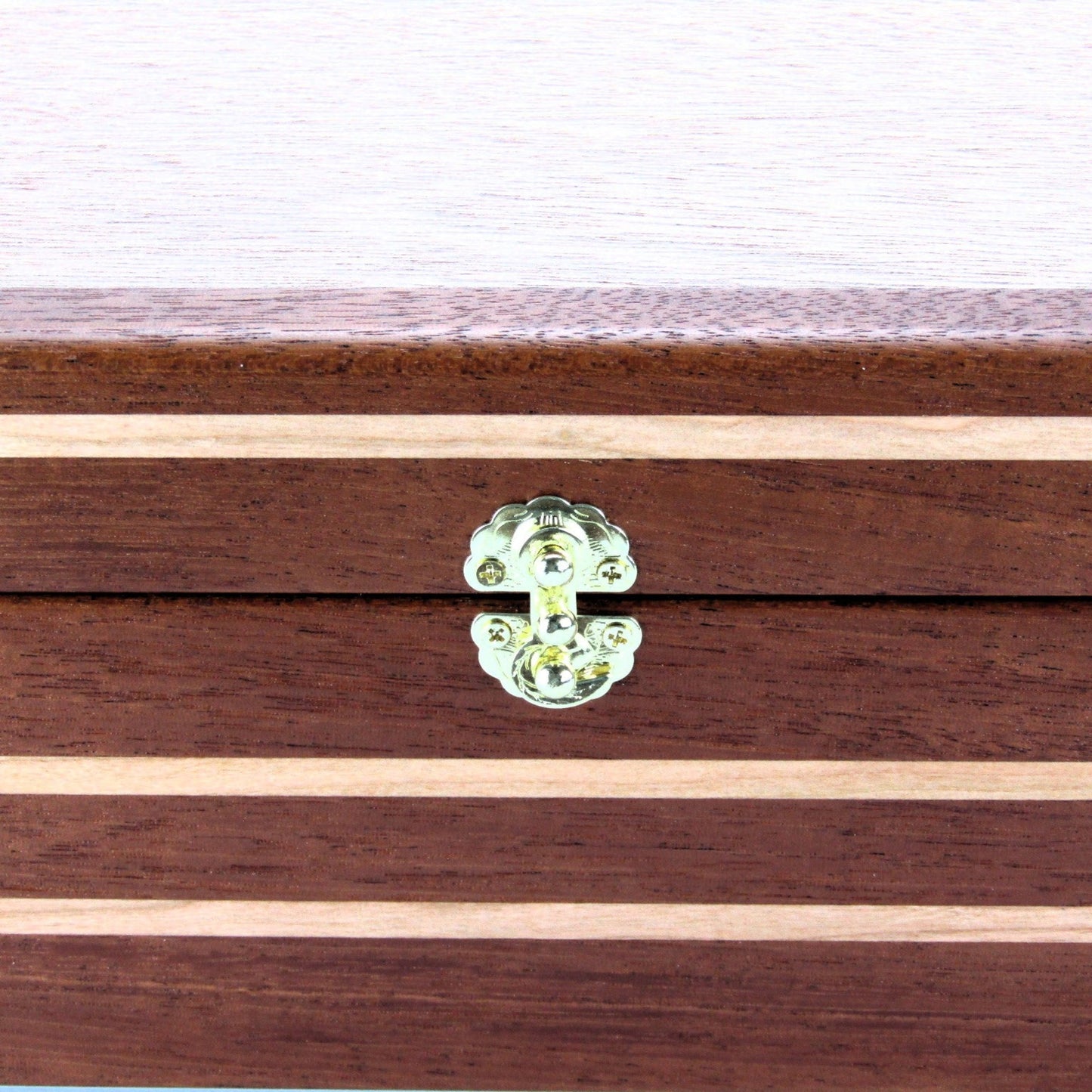 Inlays on handmade wood jewelry box crafted from mahogany, cherry, and mahogany veneer by A Finer Cut Woodwork.