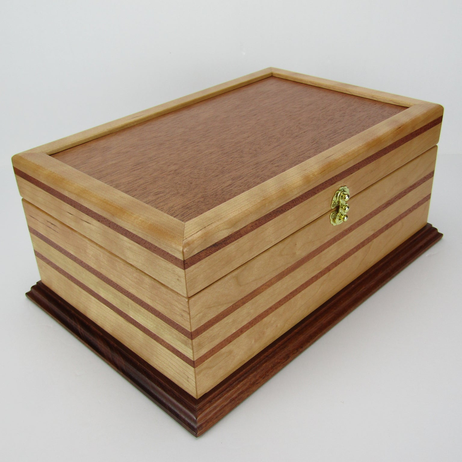 Front corner view of handmade wood jewelry box crafted from cherry with Brazilian cherry inlays by A Finer Cut Woodwork.