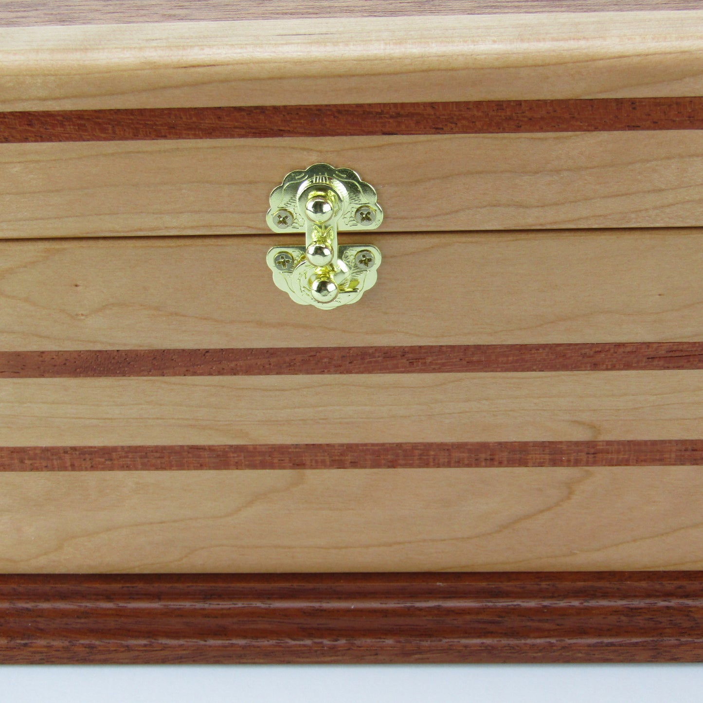 Inlays on handmade wood jewelry box crafted from cherry with Brazilian cherry inlays by A Finer Cut Woodwork.