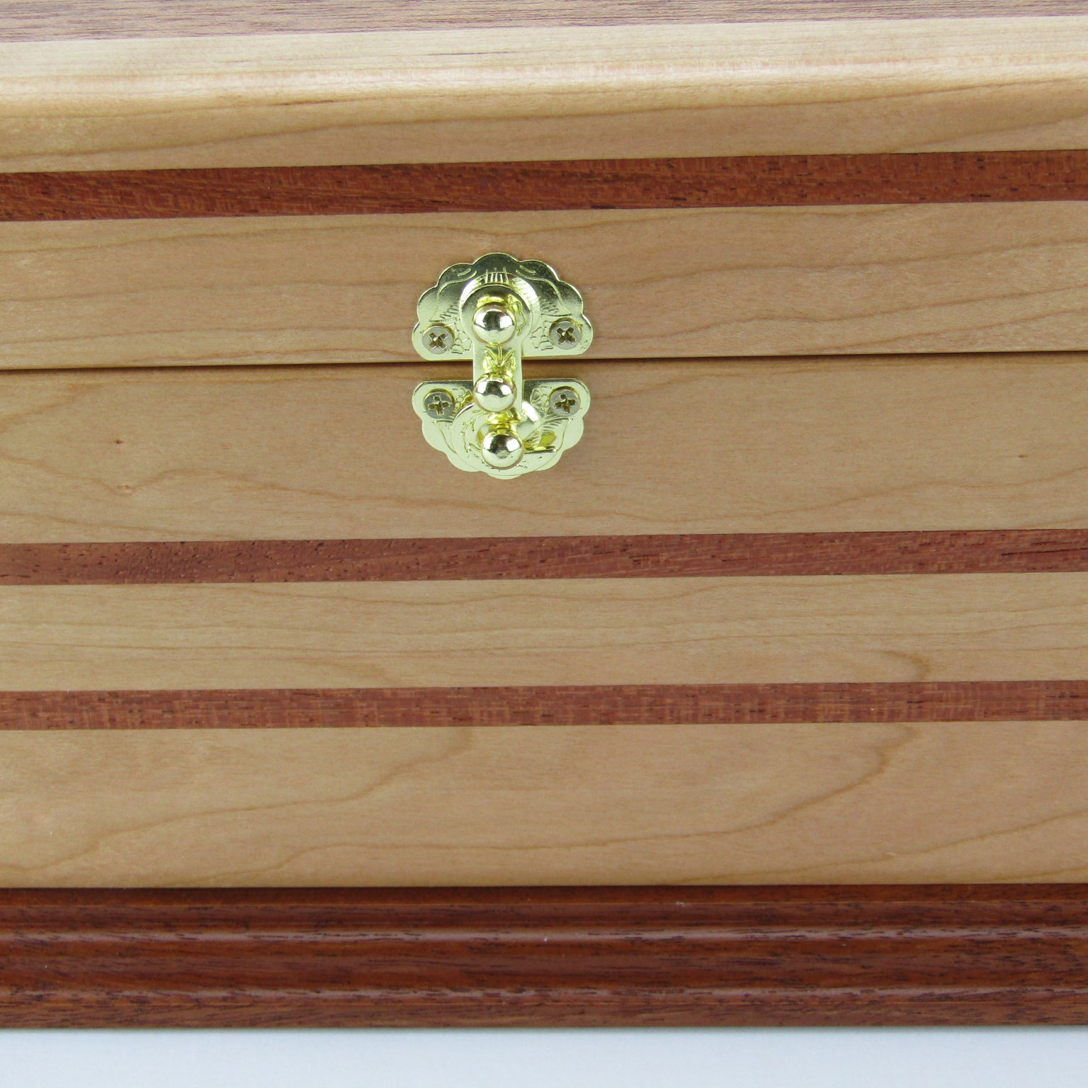 Inlays on handmade wood jewelry box crafted from cherry with Brazilian cherry inlays by A Finer Cut Woodwork.