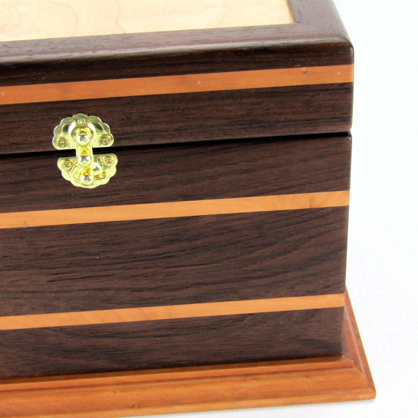 Inlays on keepsake memory box handmade from Peruvian walnut and pear wood by A Finer Cut Woodwork.