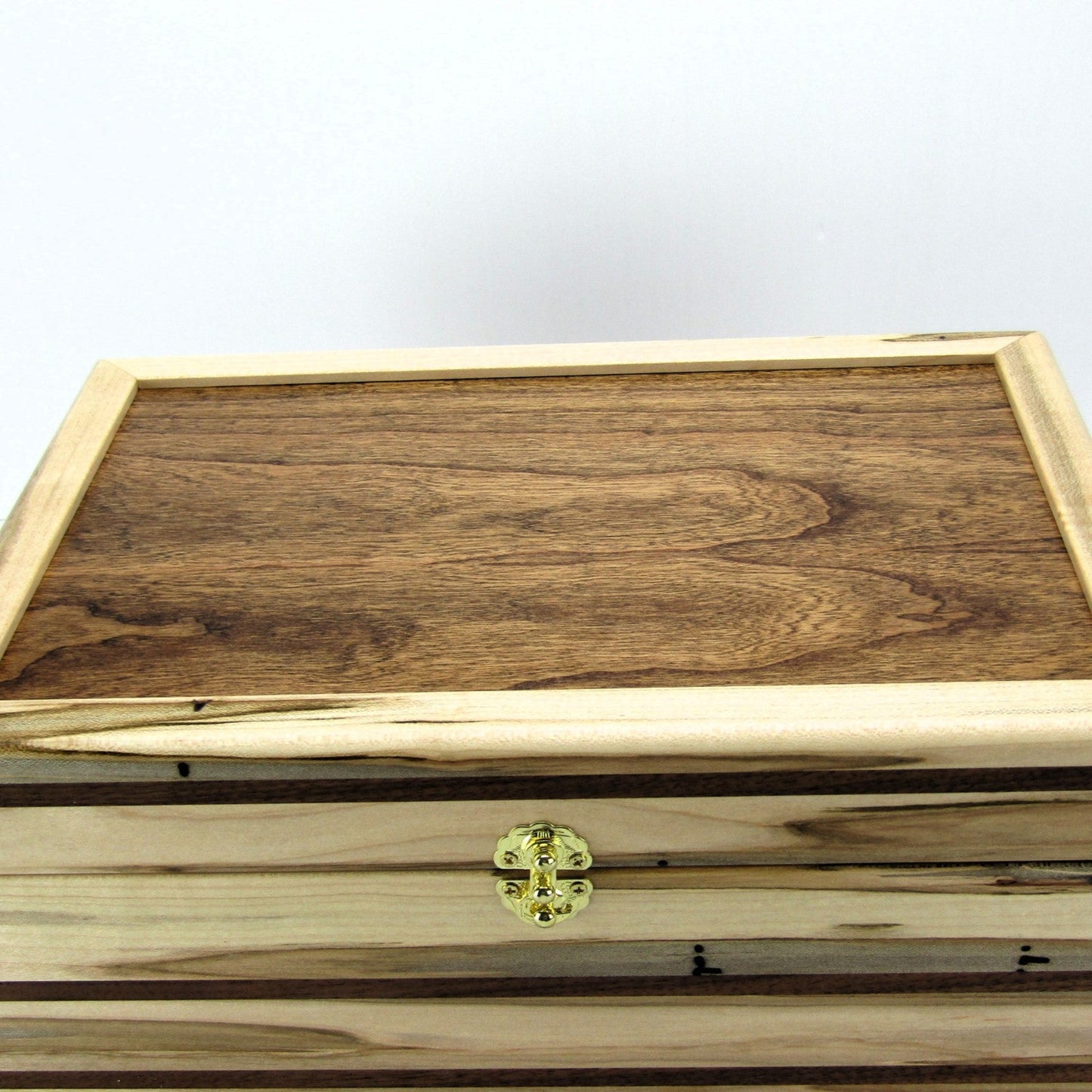 Top view of large keepsake box handmade from ambrosia maple and walnut by A Finer Cut Woodworking.