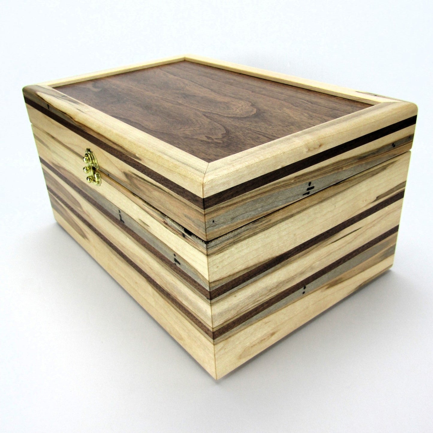 Inlays on large keepsake box handmade from ambrosia maple and walnut by A Finer Cut Woodworking.