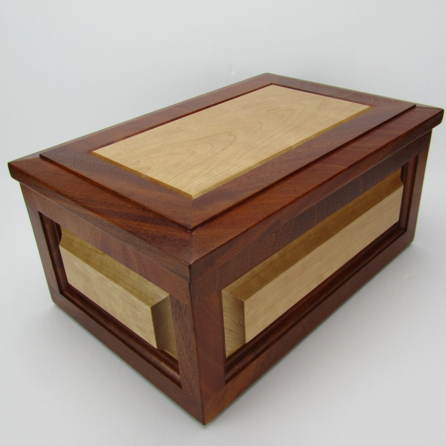 Front corner view of large keepsake box handmade from Honduran mahogany and cherry by A Finer Cut Woodworking.