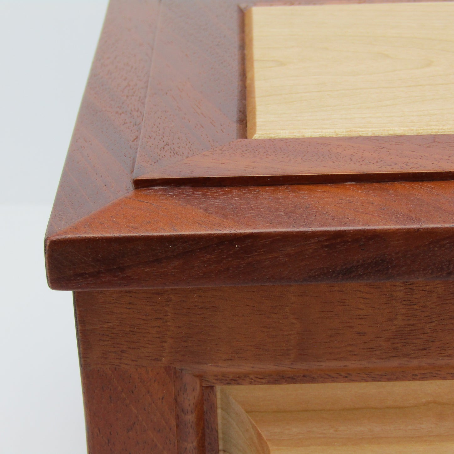 Lid details on large keepsake box handmade from Honduran mahogany and cherry by A Finer Cut Woodworking