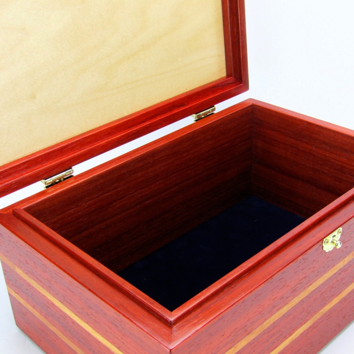 Interior view of large memory box handmade from padauk and canary wood by A Finer Cut Woodworking.