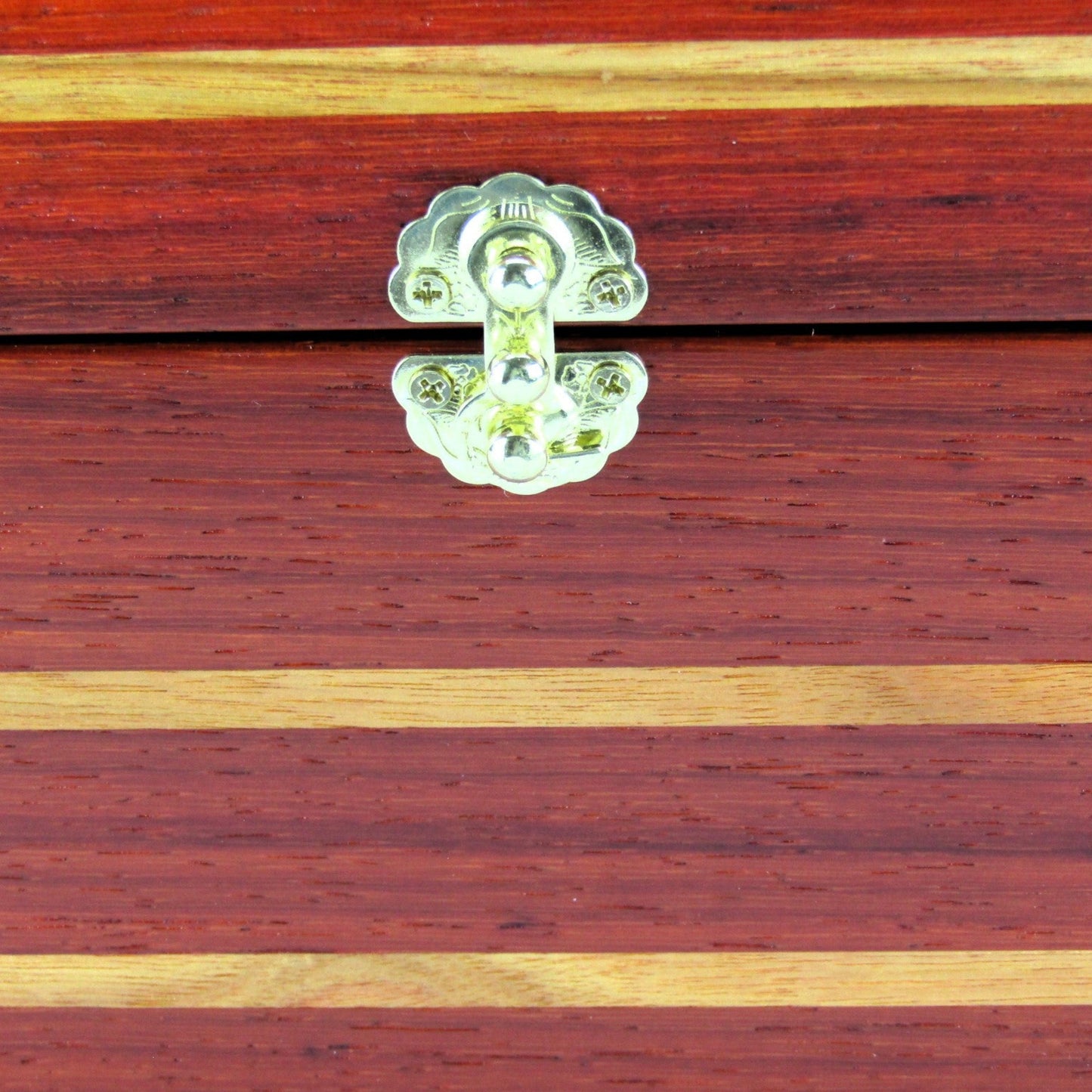 Inlays on large memory box handmade from padauk and canary wood by A Finer Cut Woodworking.