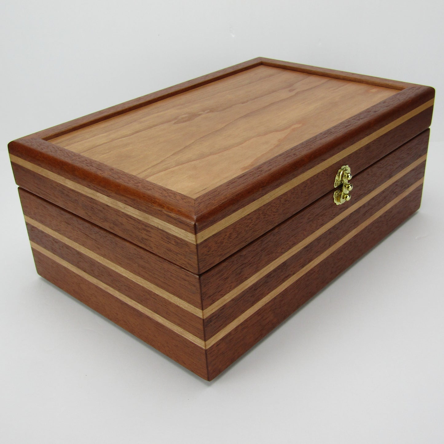 Front corner view of unique memorial box handcrafted from Honduran mahogany and cherry by A Finer Cut Woodworking.