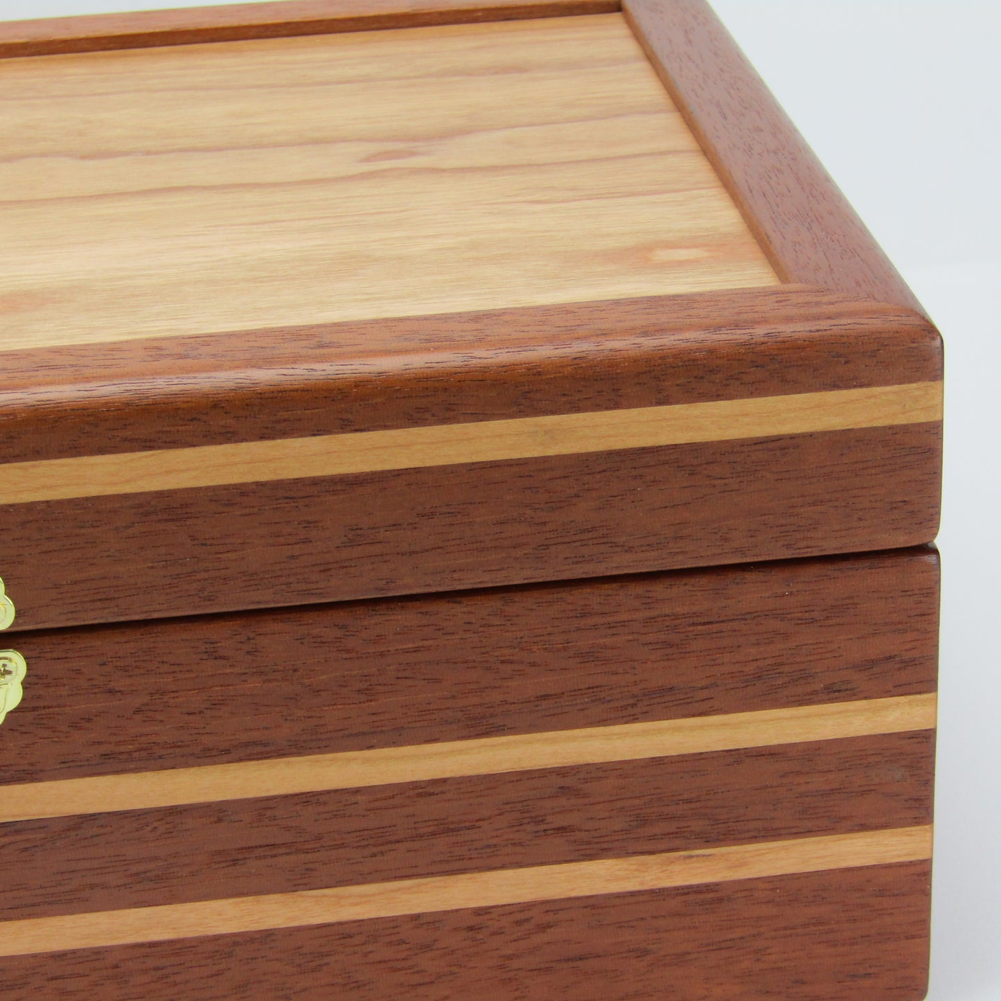 Inlays on unique memorial box handcrafted from Honduran mahogany and cherry by A Finer Cut Woodworking.