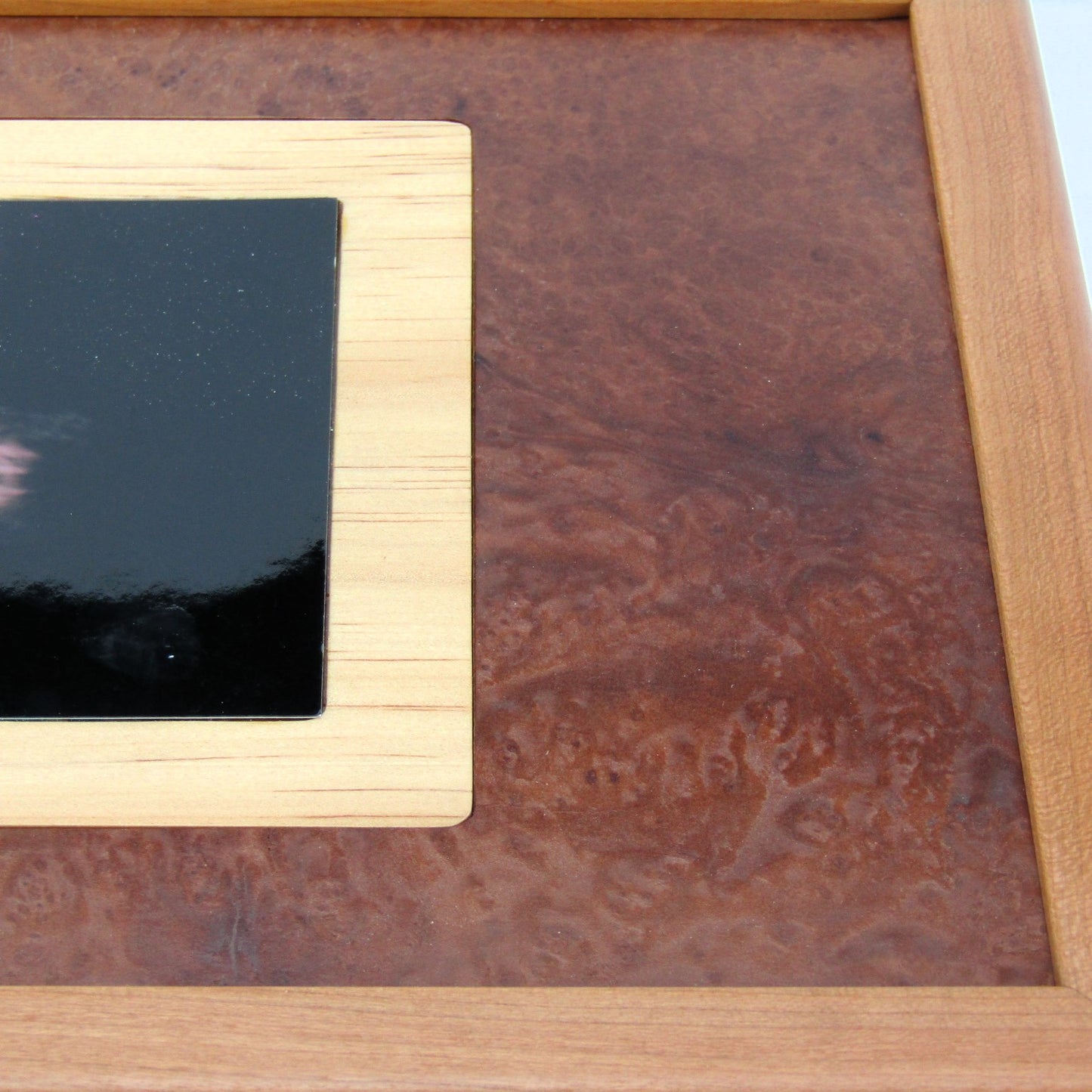 Lid details on memory box handcrafted from cherry, wenge, and mahogany burl veneer by A Finer Cut Woodworking.