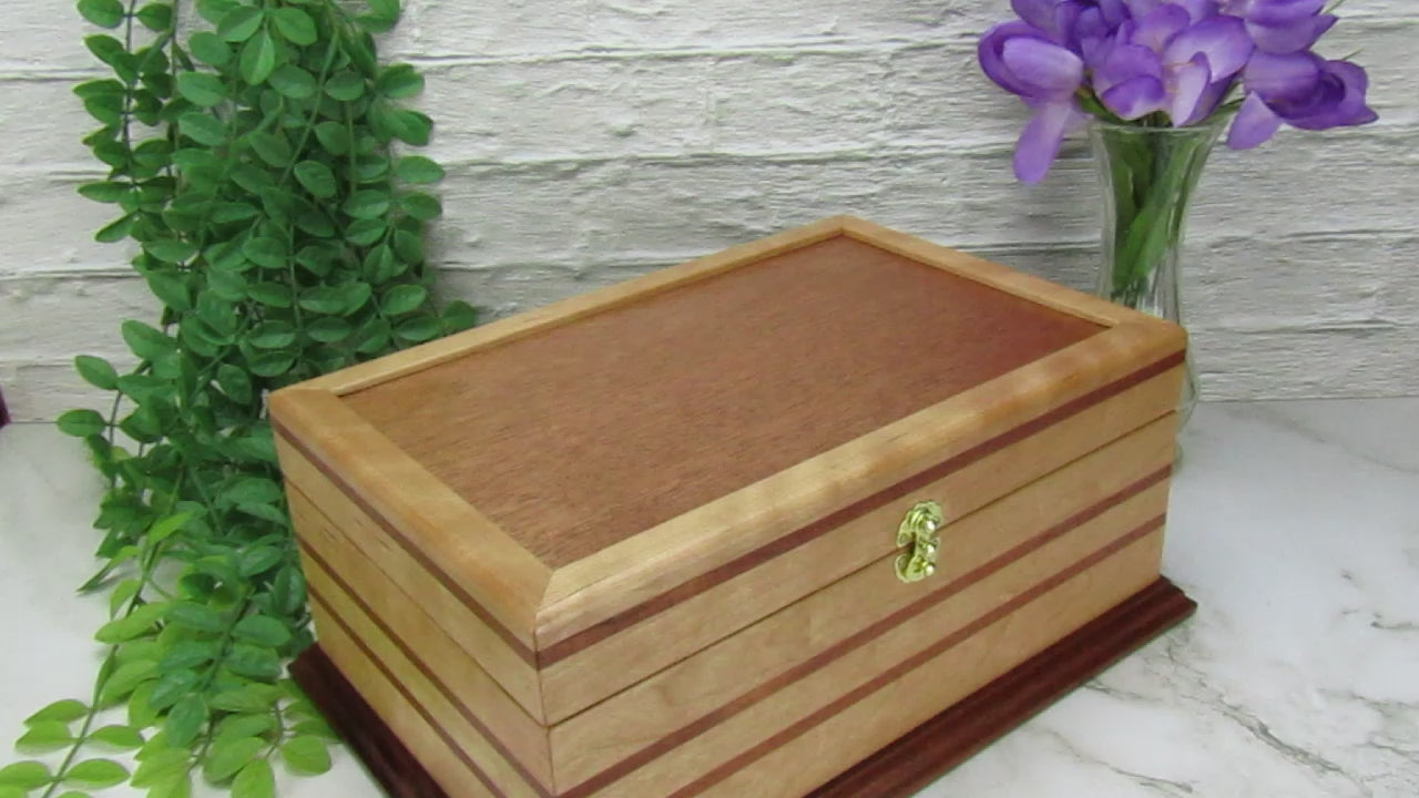 Video showing details of handmade wood jewelry box crafted from cherry with Brazilian cherry inlays by A Finer Cut Woodwork.