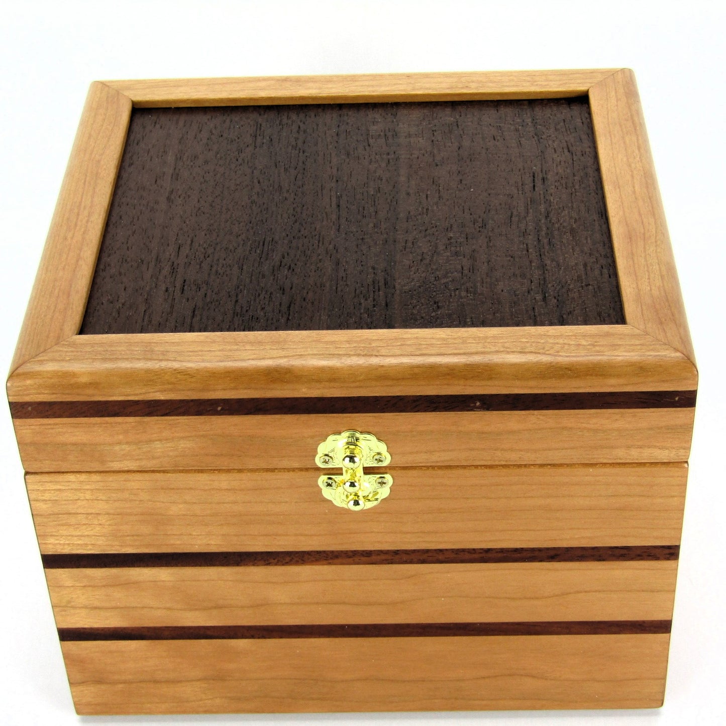 Top view of unique small keepsake box handmade from cherry, mahogany and Peruvian walnut wood by A Finer Cut.