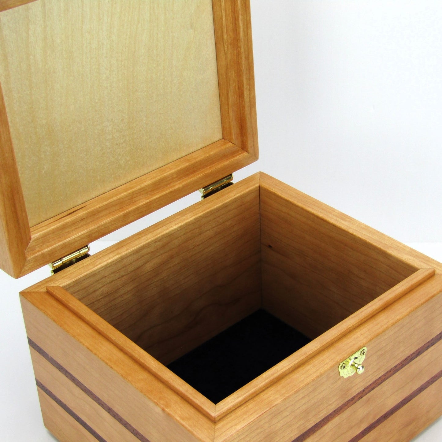 Interior view of unique small keepsake box handmade from cherry, mahogany and Peruvian walnut wood by A Finer Cut.