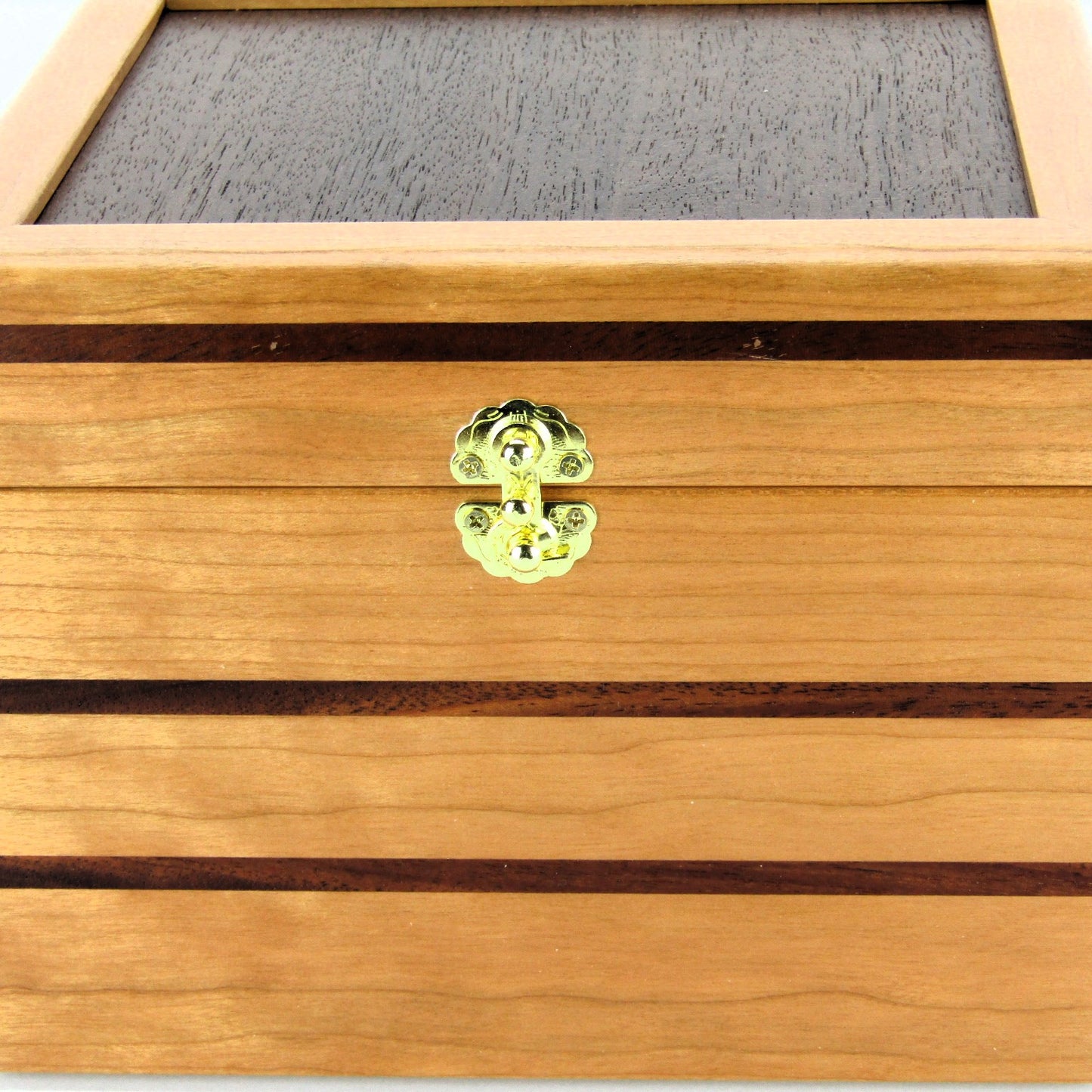 Inlays on unique small keepsake box handmade from cherry, mahogany and Peruvian walnut wood by A Finer Cut.