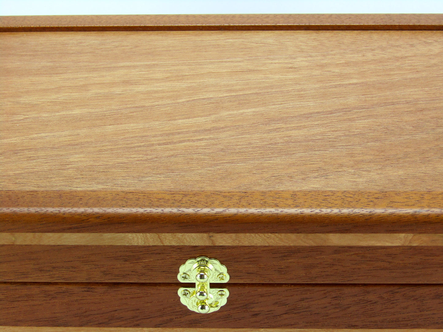 Lid details on valet box for men handcrafted from mahogany with cherry wood inlays by A Finer Cut Woodworking.