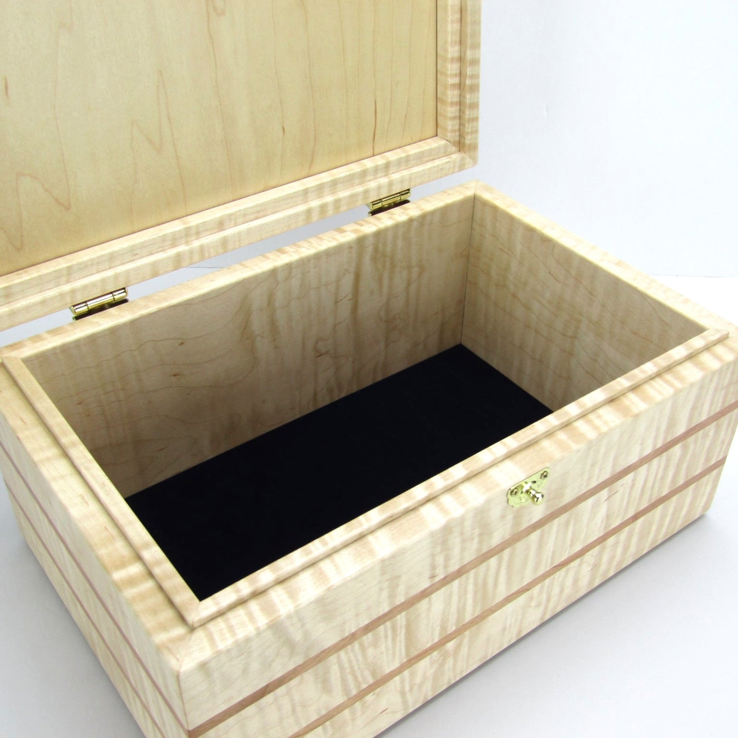Interior view of wooden memory box handmade from curly maple and cherry wood by A Finer Cut Woodworking.