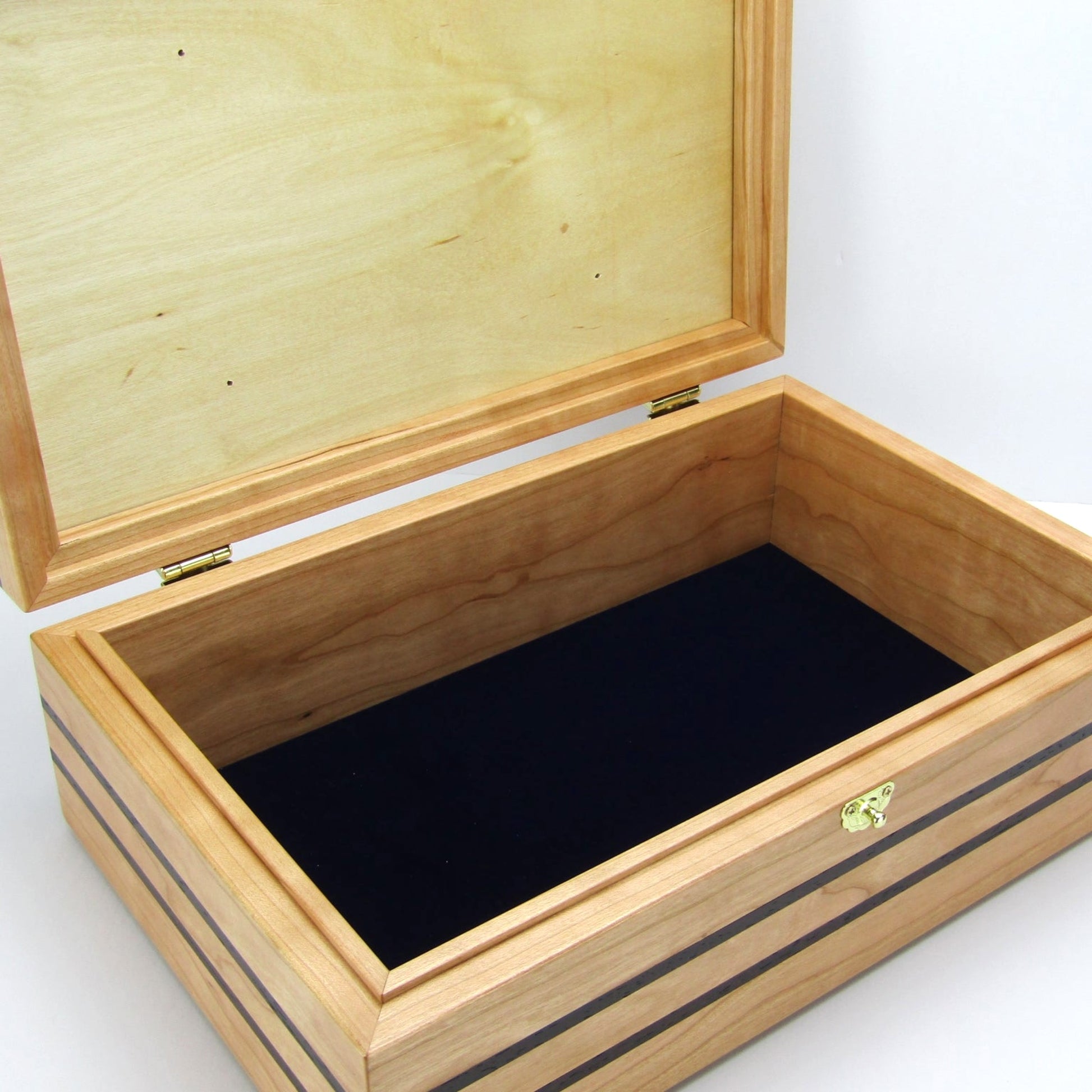 Interior view of children's memory box with photo lid handmade from cherry and wenge by A Finer Cut Woodworking. 