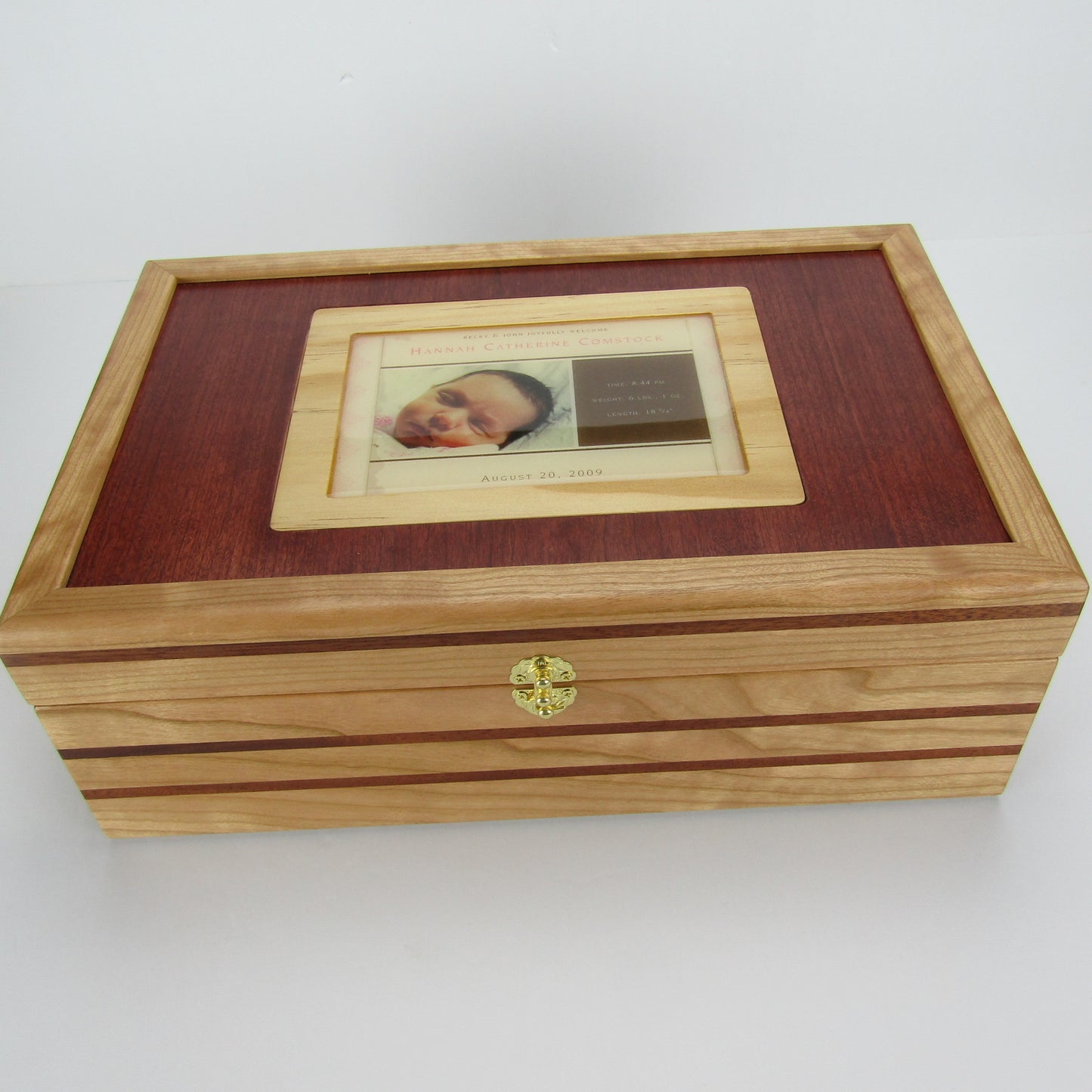 Top view of children's memory box with photo lid handmade from  cherry, mahogany, and dark finished cherry veneer by A Finer Cut Woodworking. 