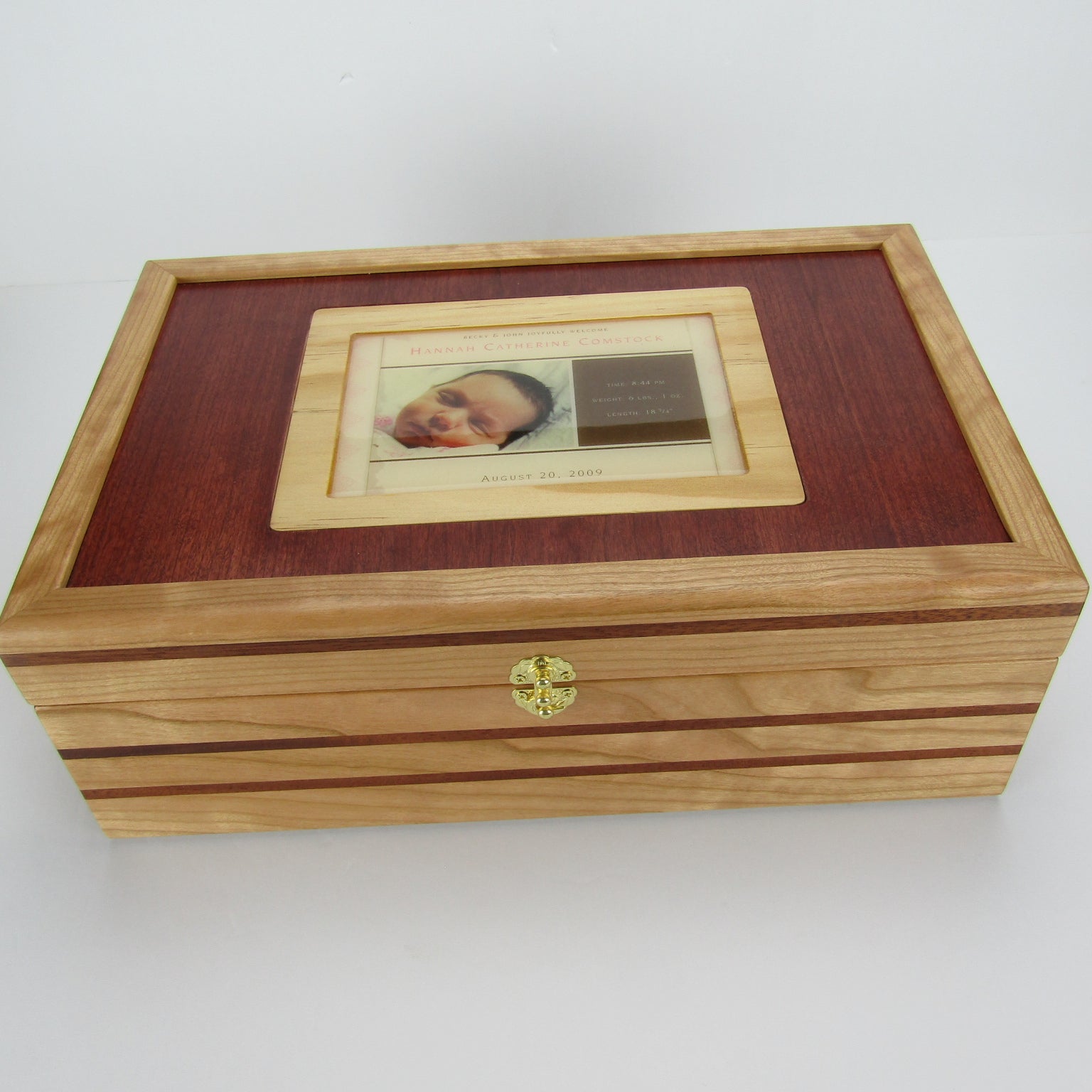 Top view of children's memory box with photo lid handmade from  cherry, mahogany, and dark finished cherry veneer by A Finer Cut Woodworking. 