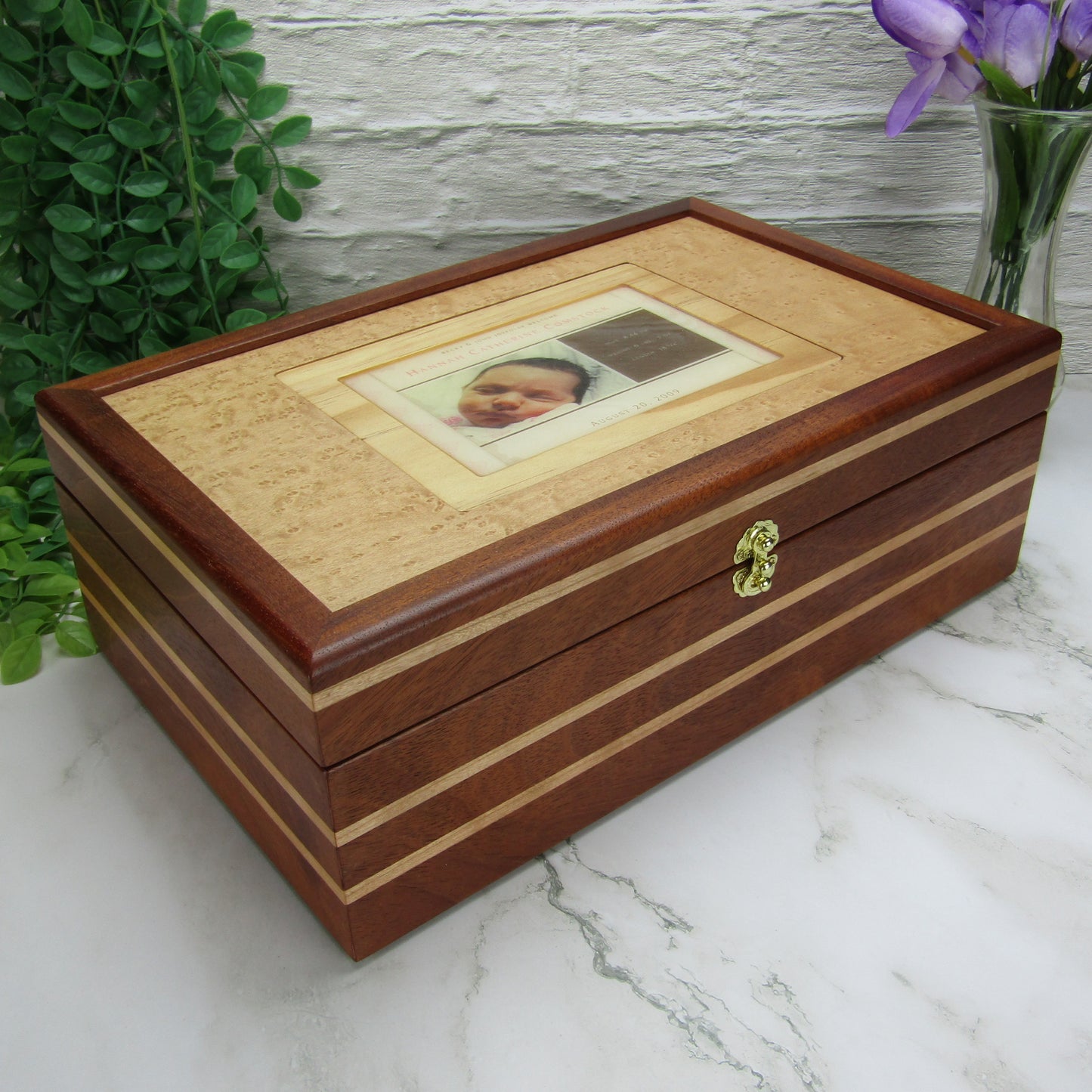 Thumbnail of children's memory box with photo lid handmade from mahogany, cherry, and maple burl veneer by A Finer Cut Woodworking. 
