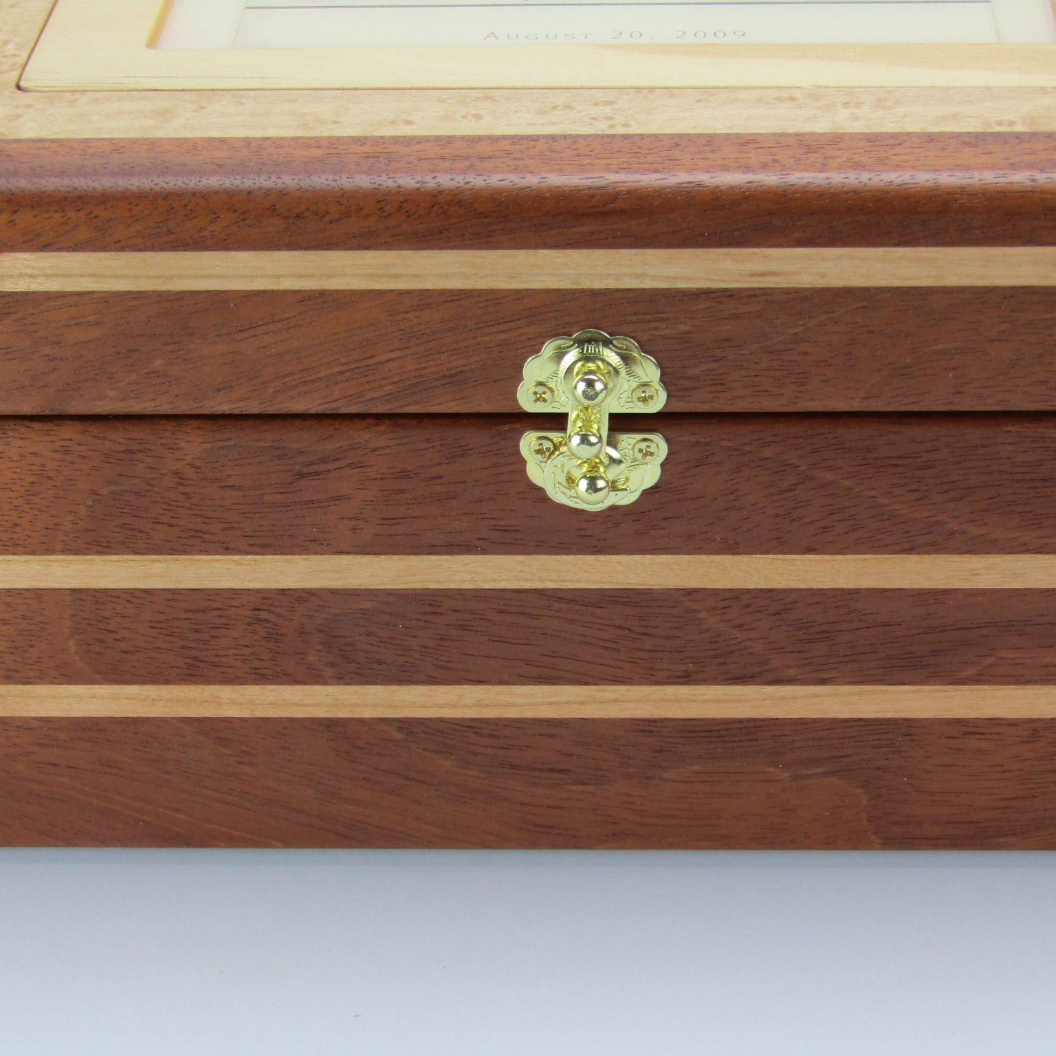 Front view of children's memory box with photo lid handmade from mahogany, cherry, and maple burl veneer by A Finer Cut Woodworking. 
