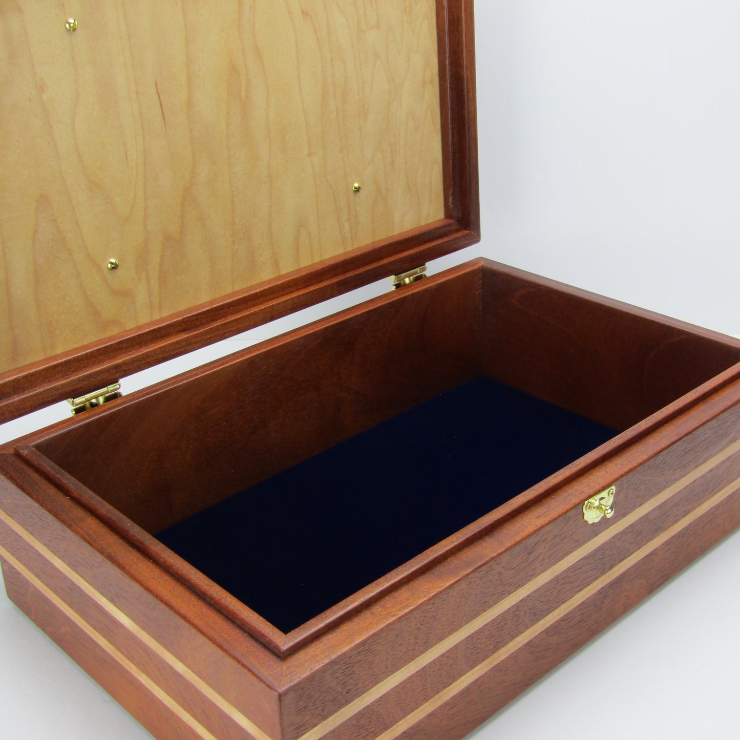 Interior view of children's memory box with photo lid handmade from mahogany, cherry, and maple burl veneer by A Finer Cut Woodworking. 