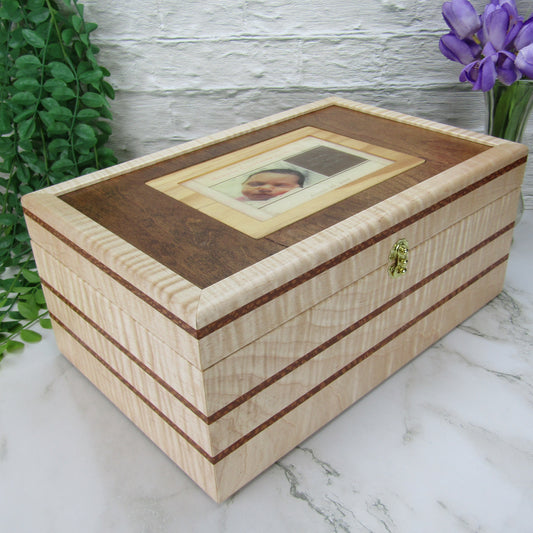 Thumbnail of children's memory box with photo lid handmade from  curly maple, leopardwood, dark finished cherry veneer by A Finer Cut Woodworking. 