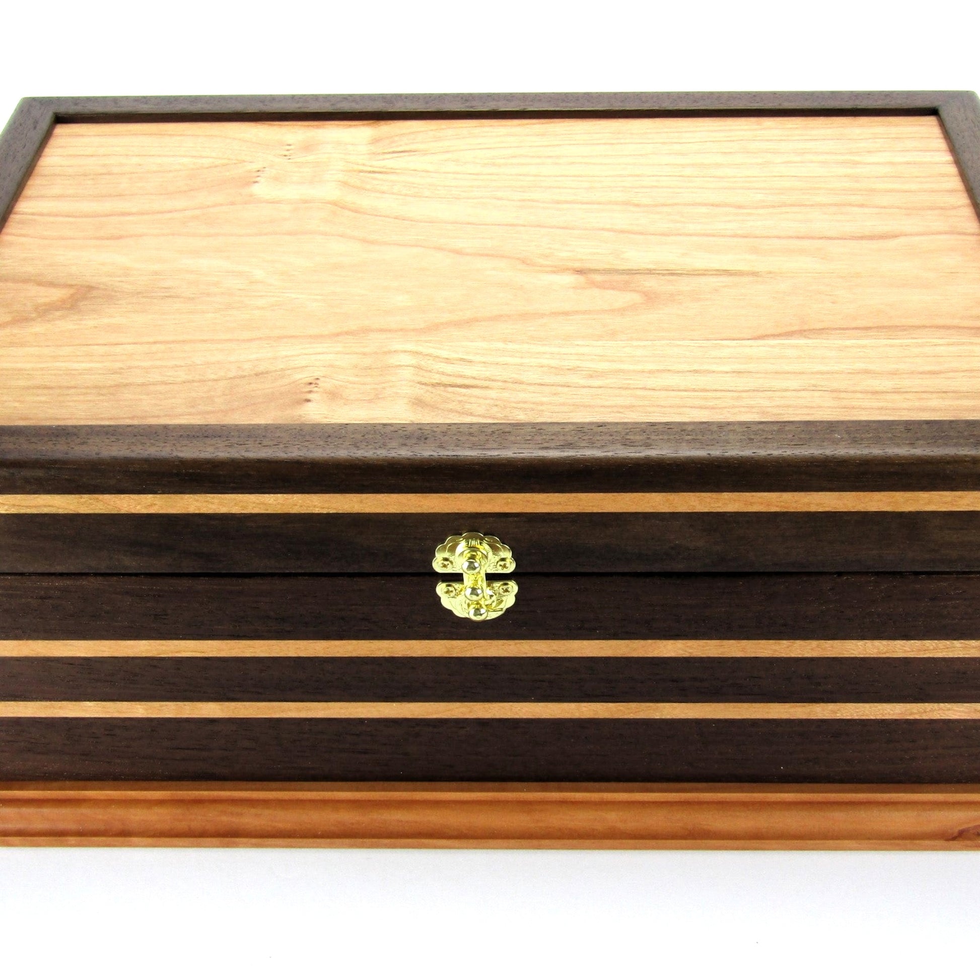 Front view of handmade keepsake box crafted from Peruvian walnut, cherry, cherry veneer, and a pear base by A Finer Cut Woodworking.