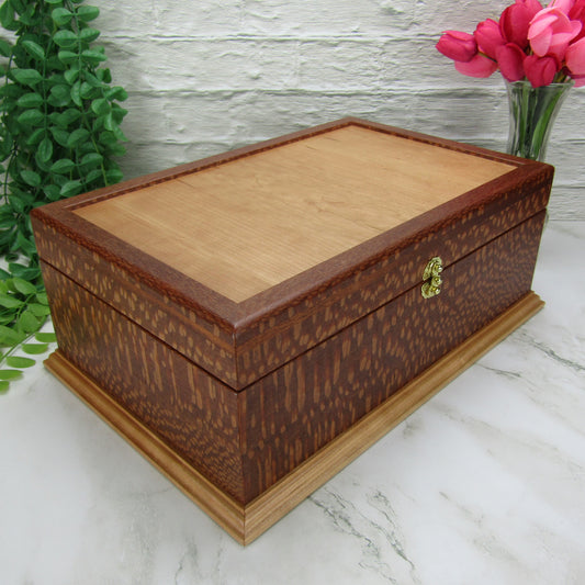Thumbnail of handmade keepsake box crafted from leopardwood, mahogany, and cherry veneer by A Finer Cut Woodworking.