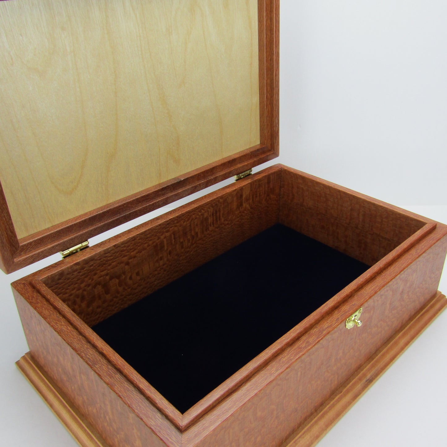 Interior view of handmade keepsake box crafted from leopardwood, cherry, and mahogany veneer by A Finer Cut Woodworking.
