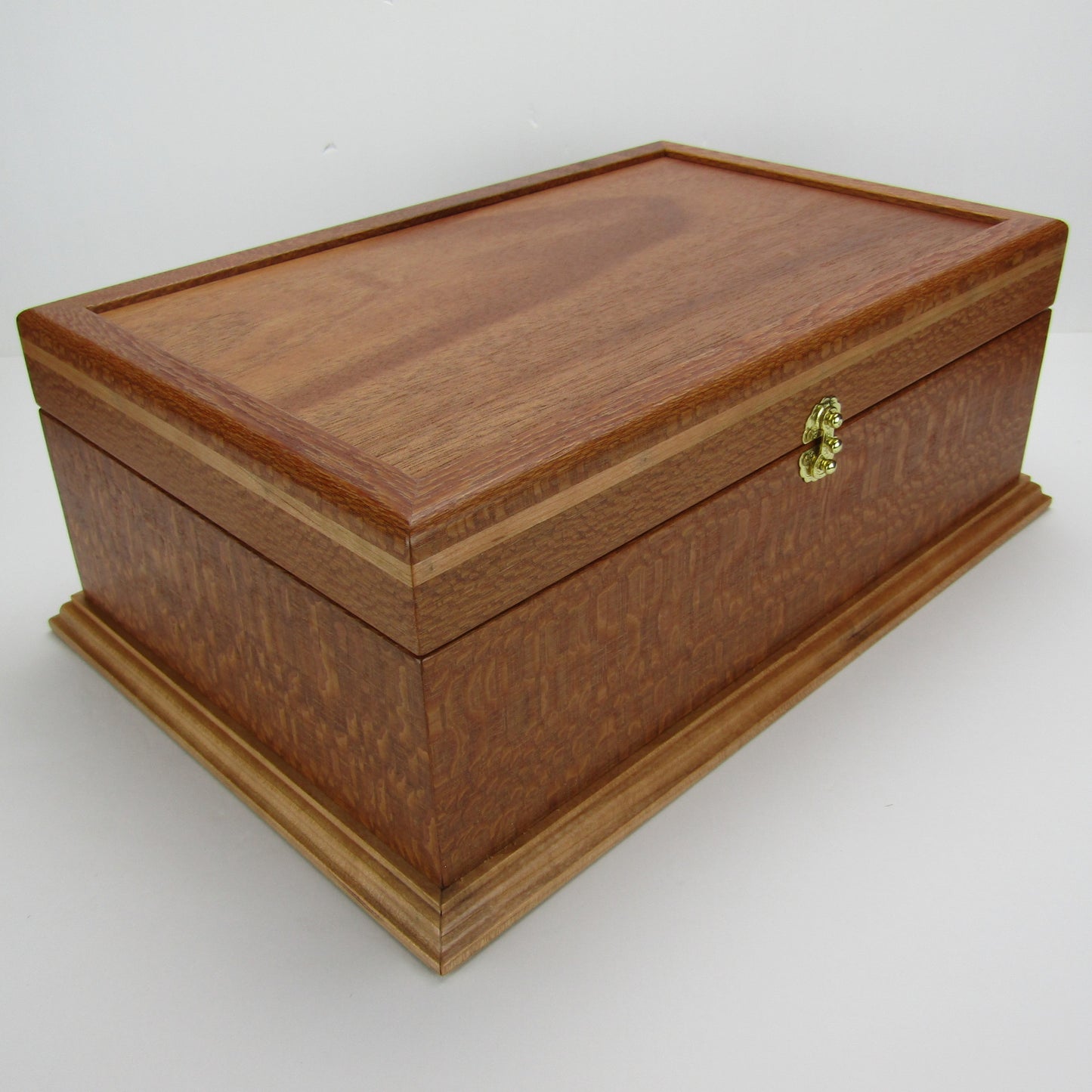 Front corner view of handmade keepsake box crafted from leopardwood, cherry, and mahogany veneer by A Finer Cut Woodworking.