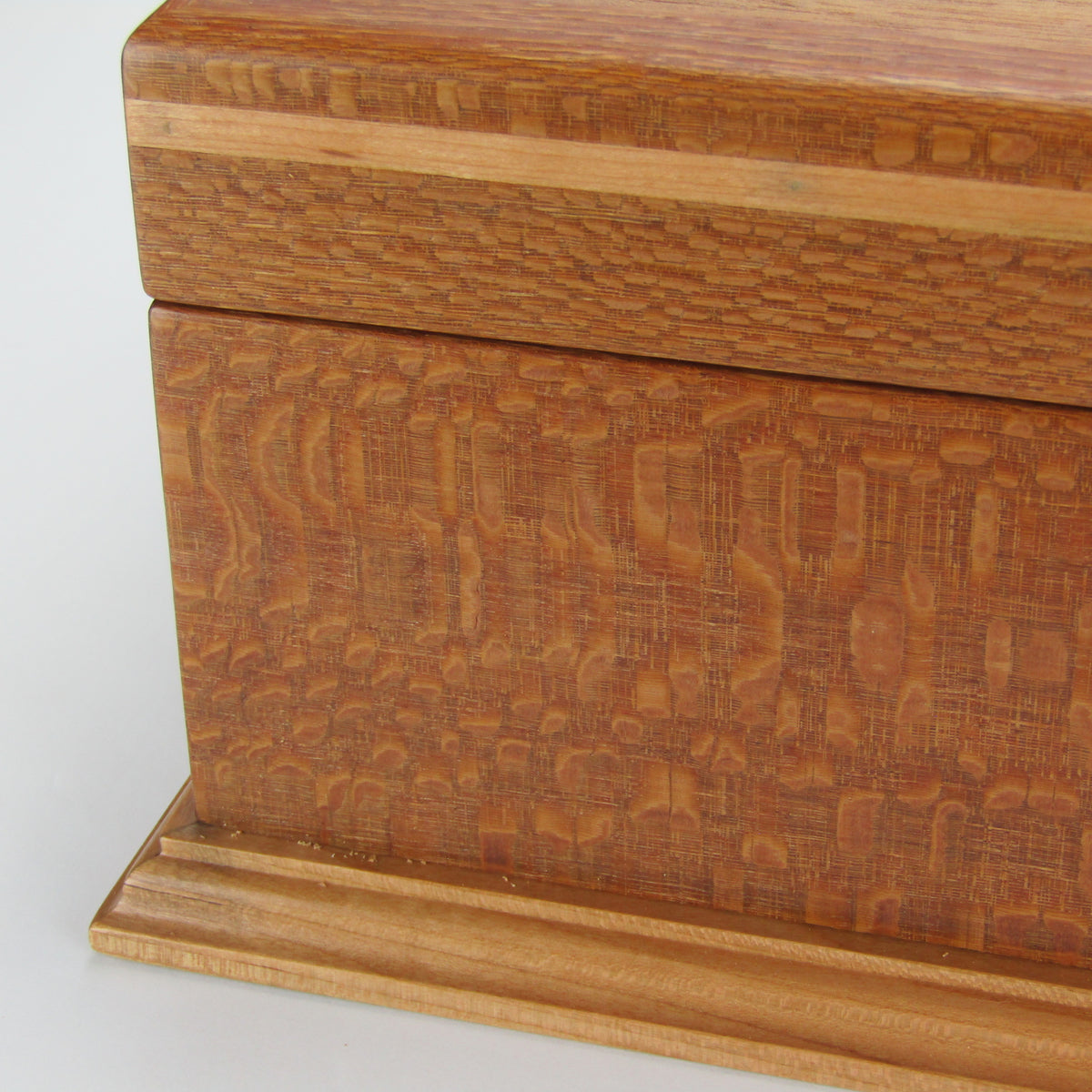 Inlays on handmade keepsake box crafted from leopardwood, cherry, and mahogany veneer by A Finer Cut Woodworking.
