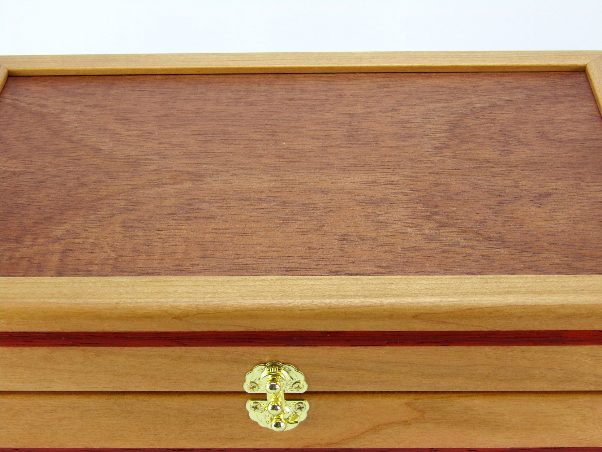 Lid details on handmade memory box crafted from cherry and mahogany wood with padauk inlays by A Finer Cut Wood.