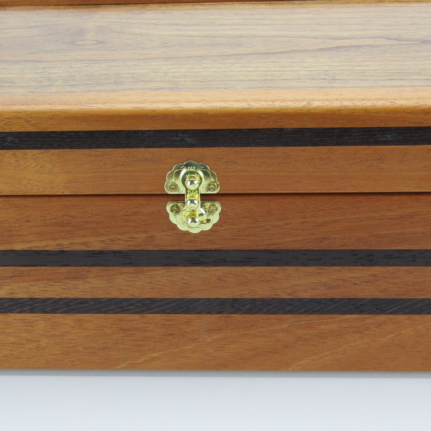 Front view of handmade memory box crafted from mahogany, wenge, and dark finished cherry veneer by A Finer Cut Woodworking.