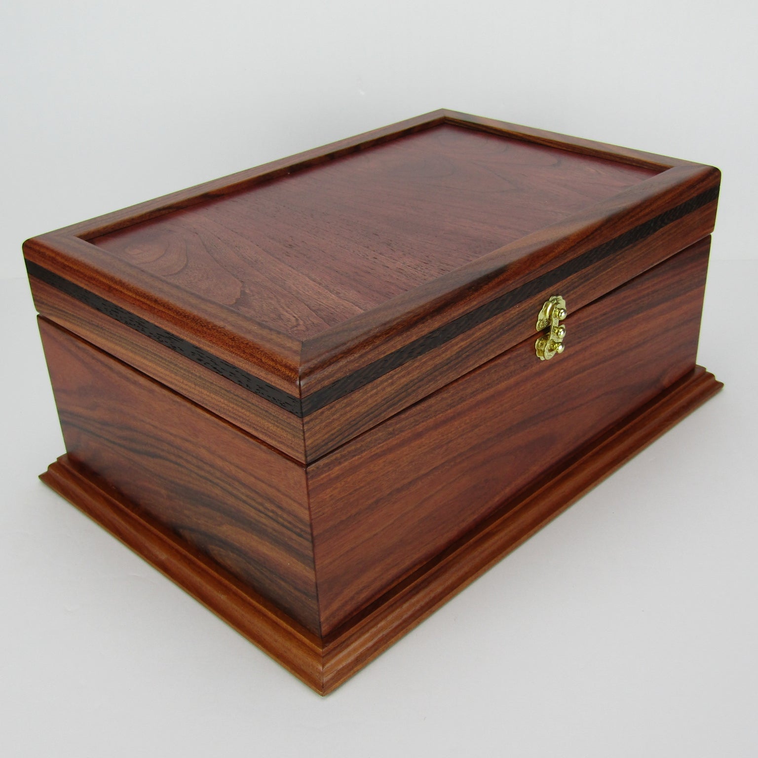 >Front corner view of handmade wood jewelry box crafted from Bolivian rosewood, wenge, and cherry veneer by A Finer Cut Woodworking.