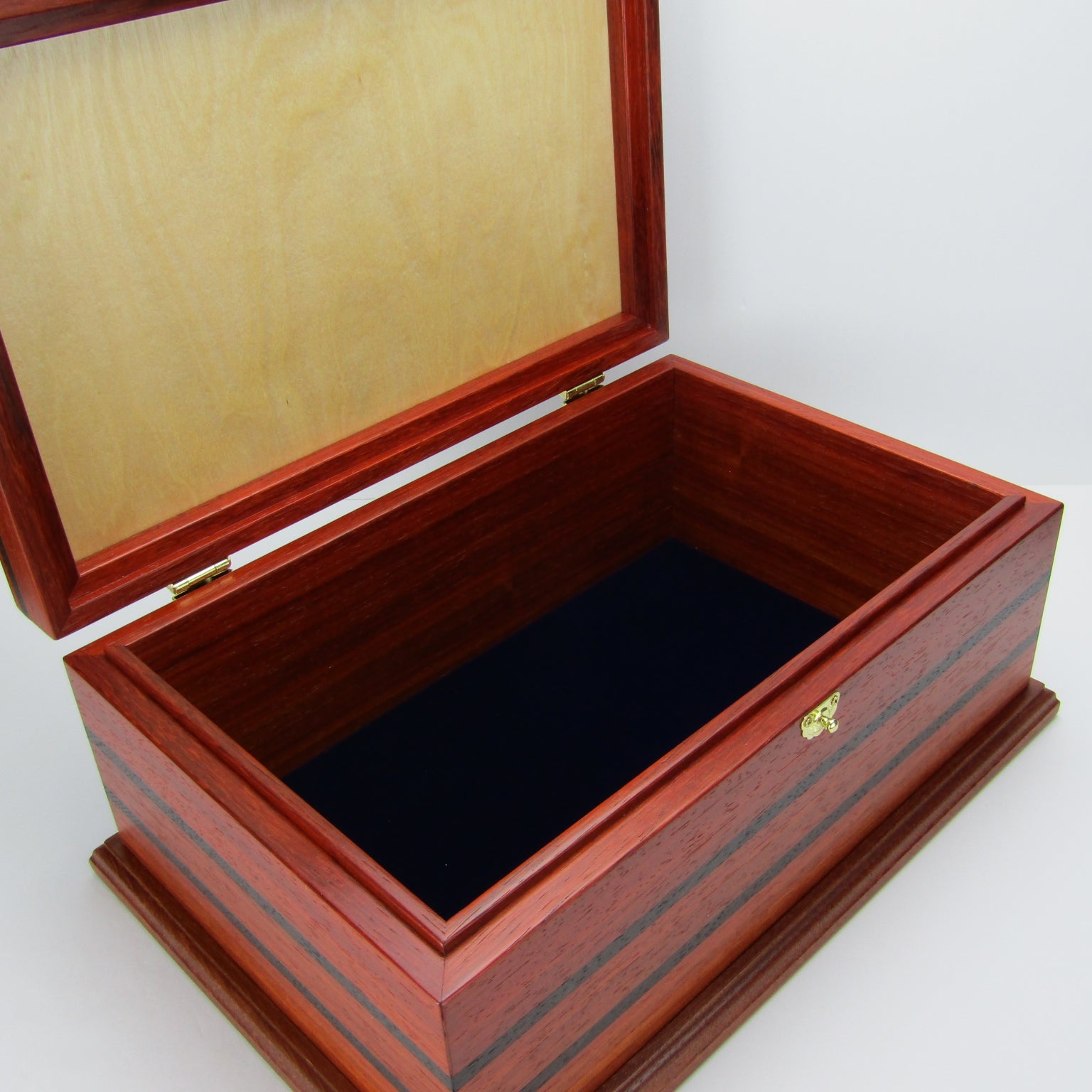 Interior view of handmade wooden box crafted from padauk, wenge, Brazilian cherry, and walnut burl veneer by A Finer Cut Woodworking.