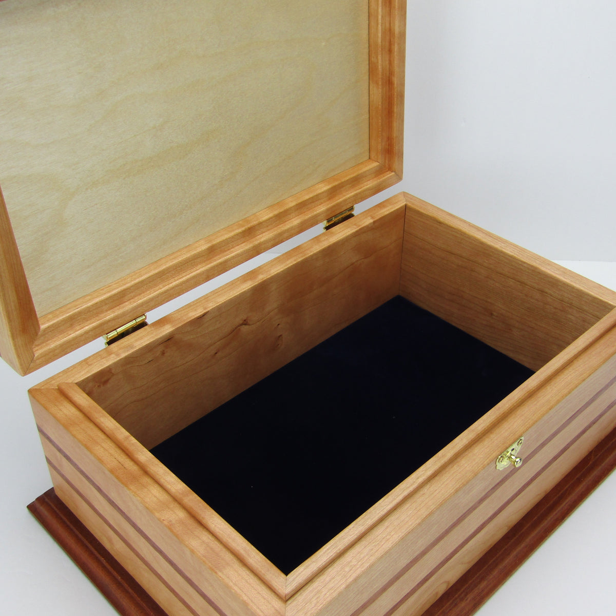 Interior view of handmade wood jewelry box crafted from cherry, mahogany, and mahogany veneer by A Finer Cut Woodworking.
