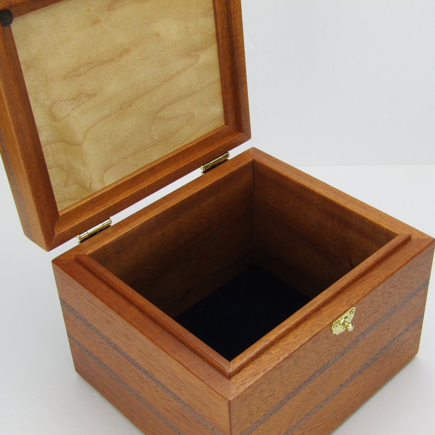 Interior view of keepsake memory box handmade from mahogany, walnut, and dark finished cherry veneer by A Finer Cut Woodworking.
