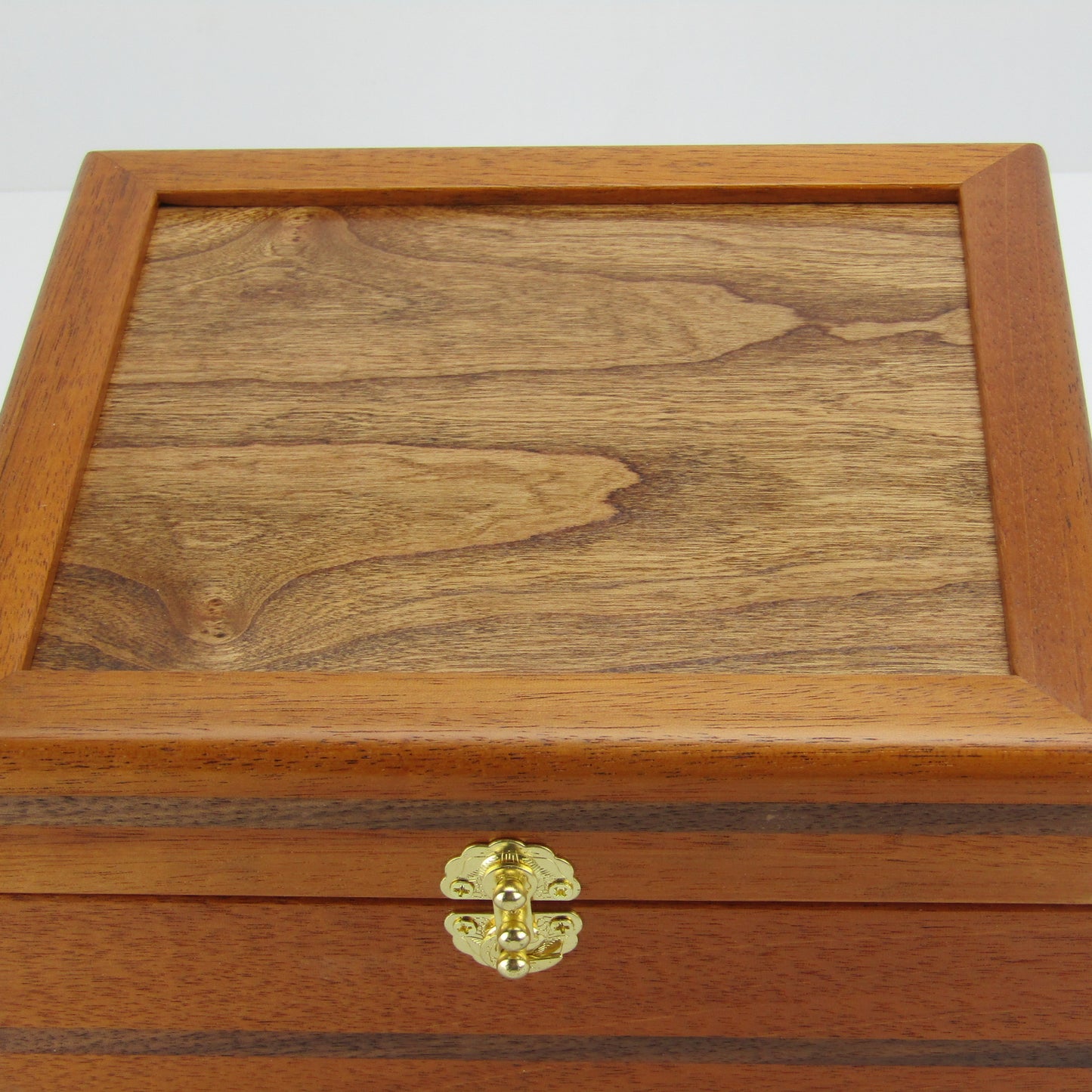 Top view of keepsake memory box handmade from mahogany, walnut, and dark finished cherry veneer by A Finer Cut Woodworking.