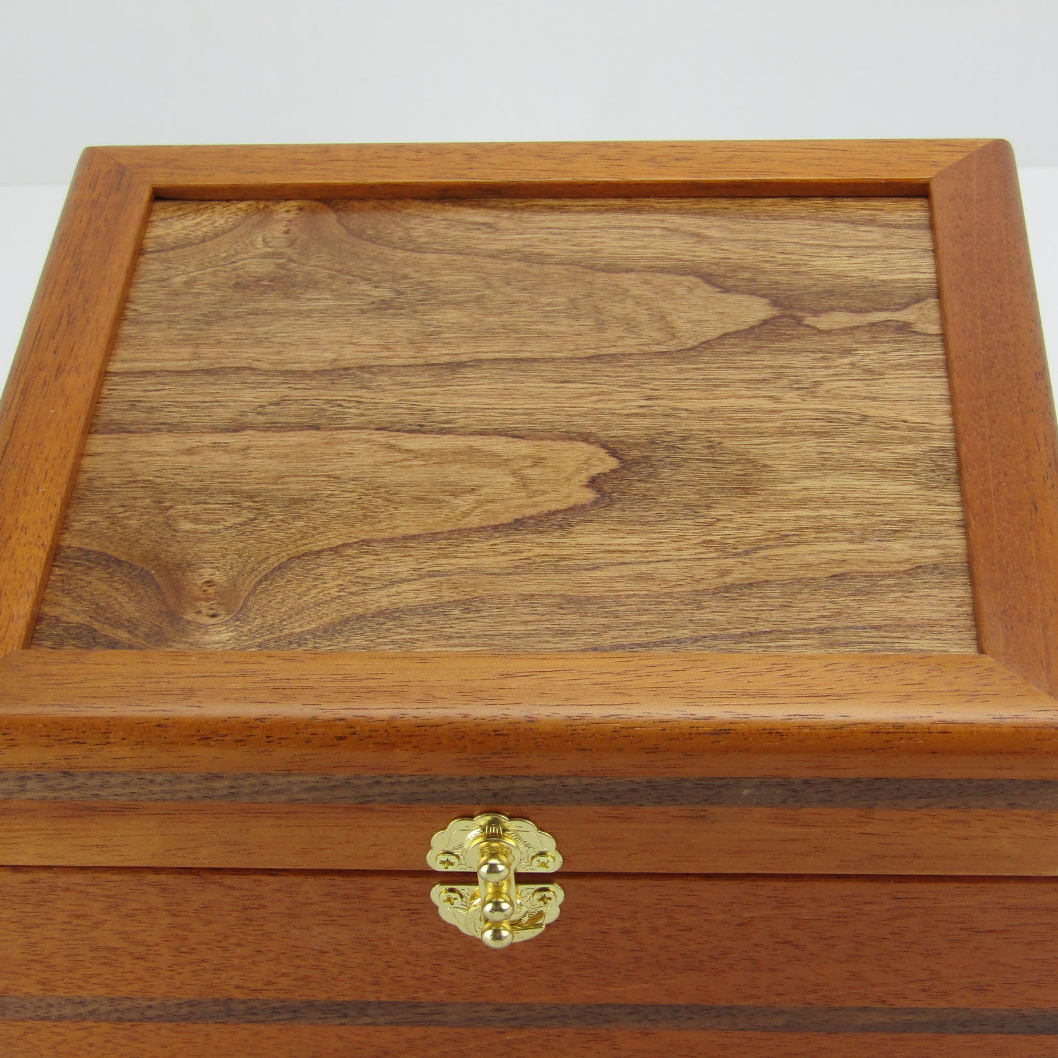 Top view of keepsake memory box handmade from mahogany, walnut, and dark finished cherry veneer by A Finer Cut Woodworking.