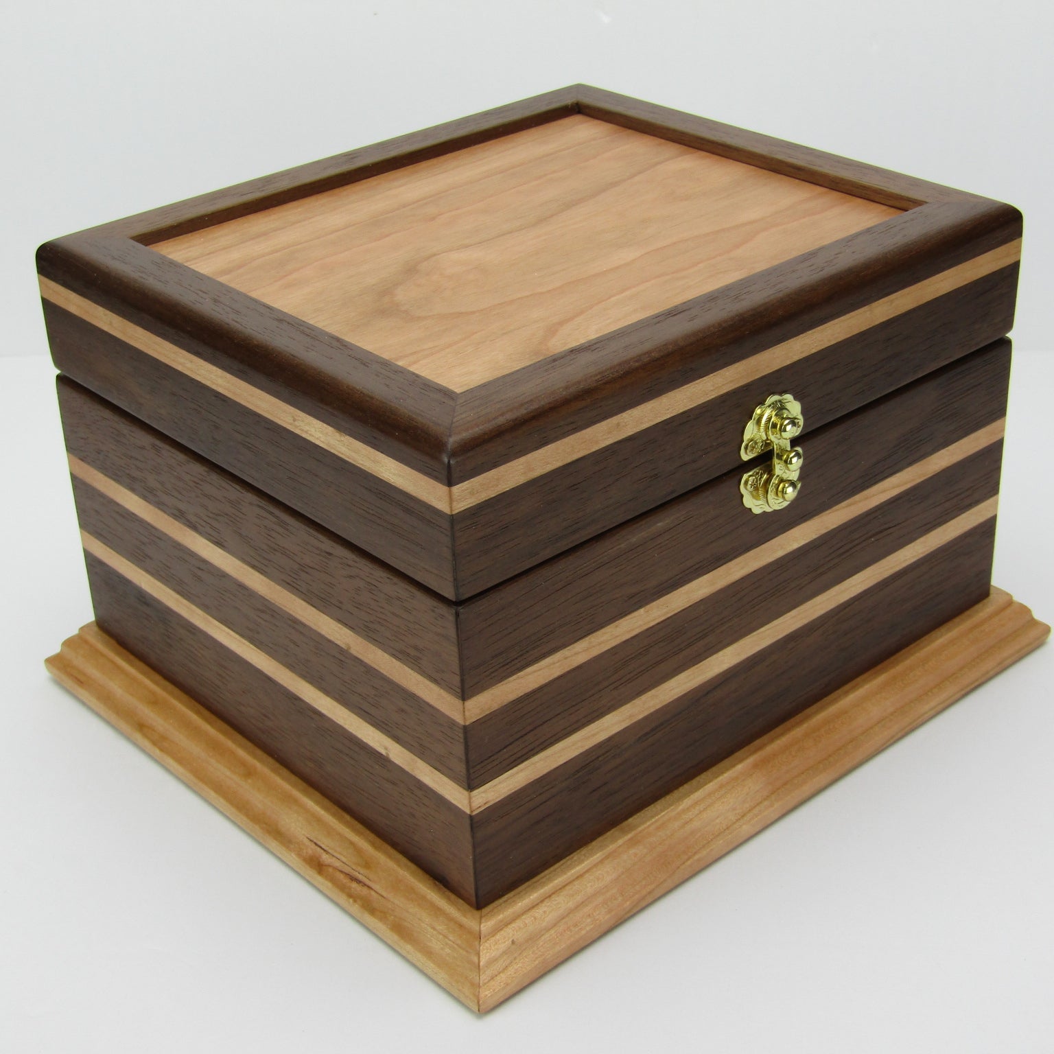 Front corner view of keepsake memory box handmade from Peruvian walnut and cherry by A Finer Cut Woodwork.
