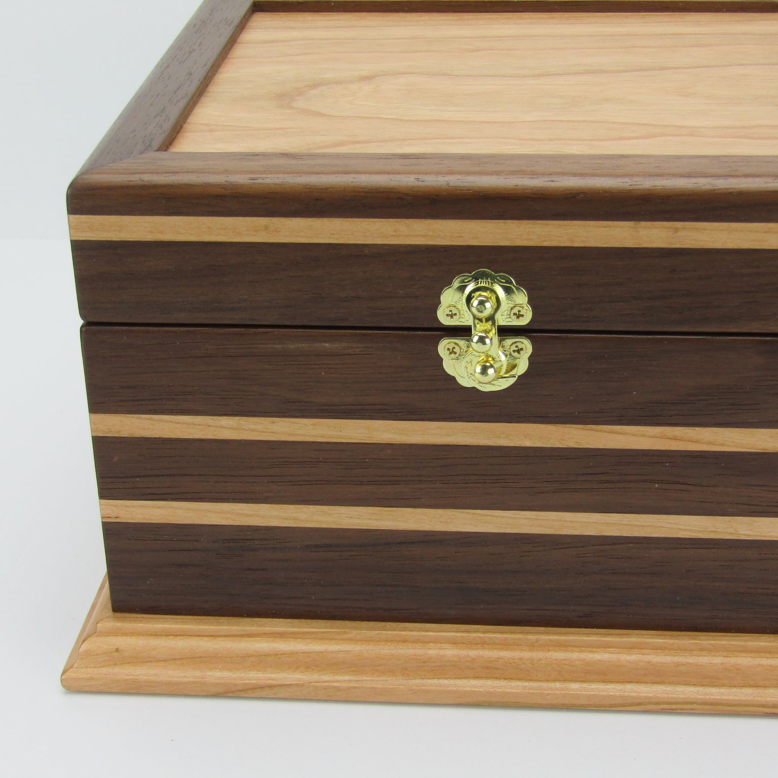 Inlays on keepsake memory box handmade from Peruvian walnut and cherry by A Finer Cut Woodwork.