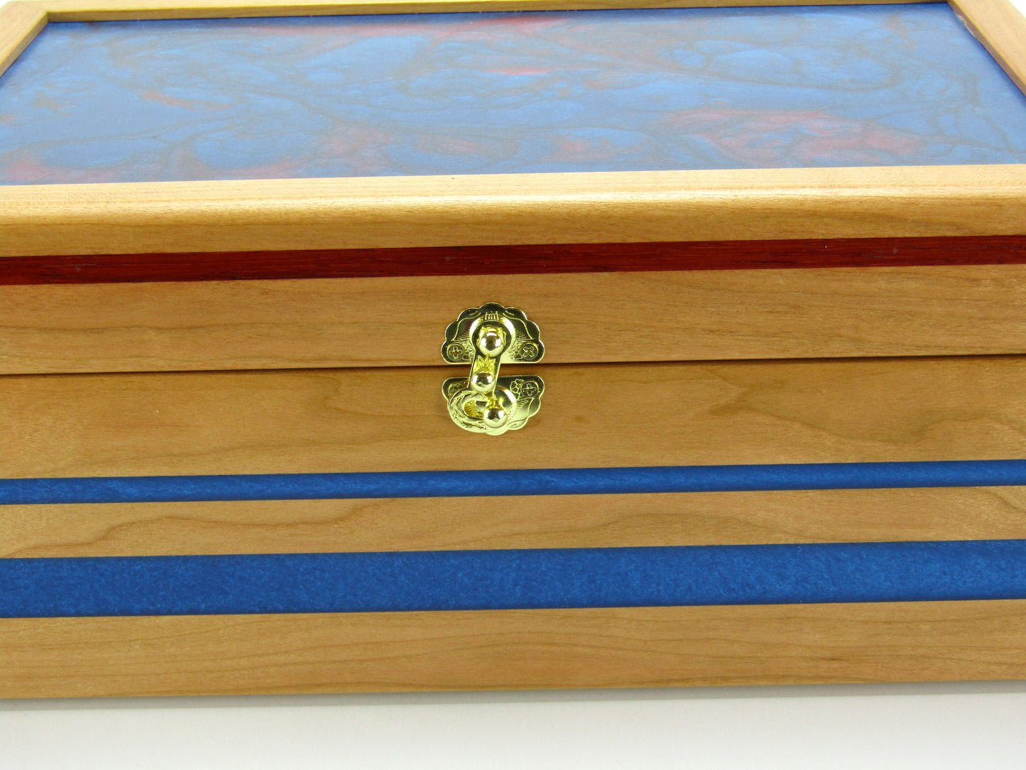 Inlays on keepsake memory box handmade from cherry wood with padauk and epoxy inlays by A Finer Cut Woodwork.