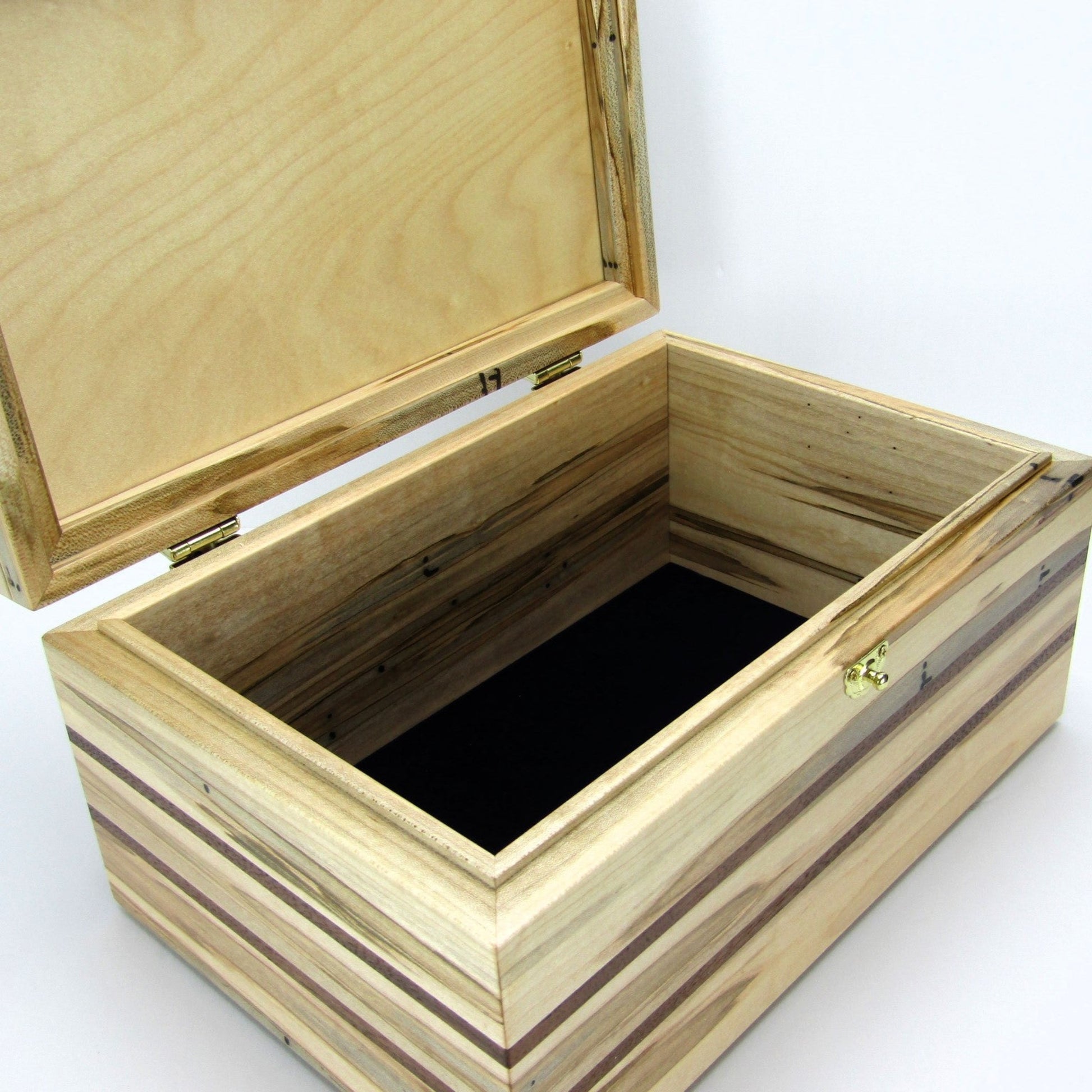 Interior view of large keepsake box handmade from ambrosia maple and walnut by A Finer Cut Woodworking.