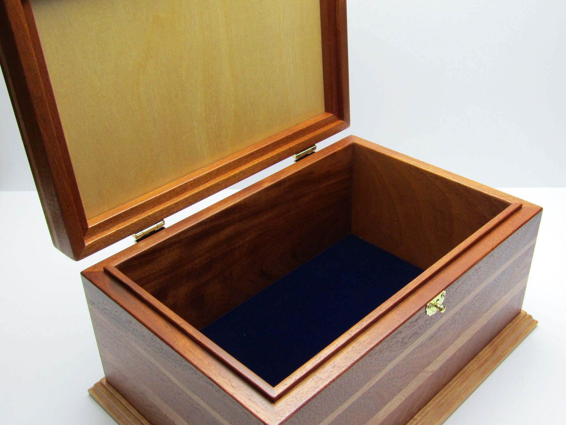 Interior view of large keepsake box handmade from Honduran mahogany and cherry wood by A Finer Cut Woodworking.